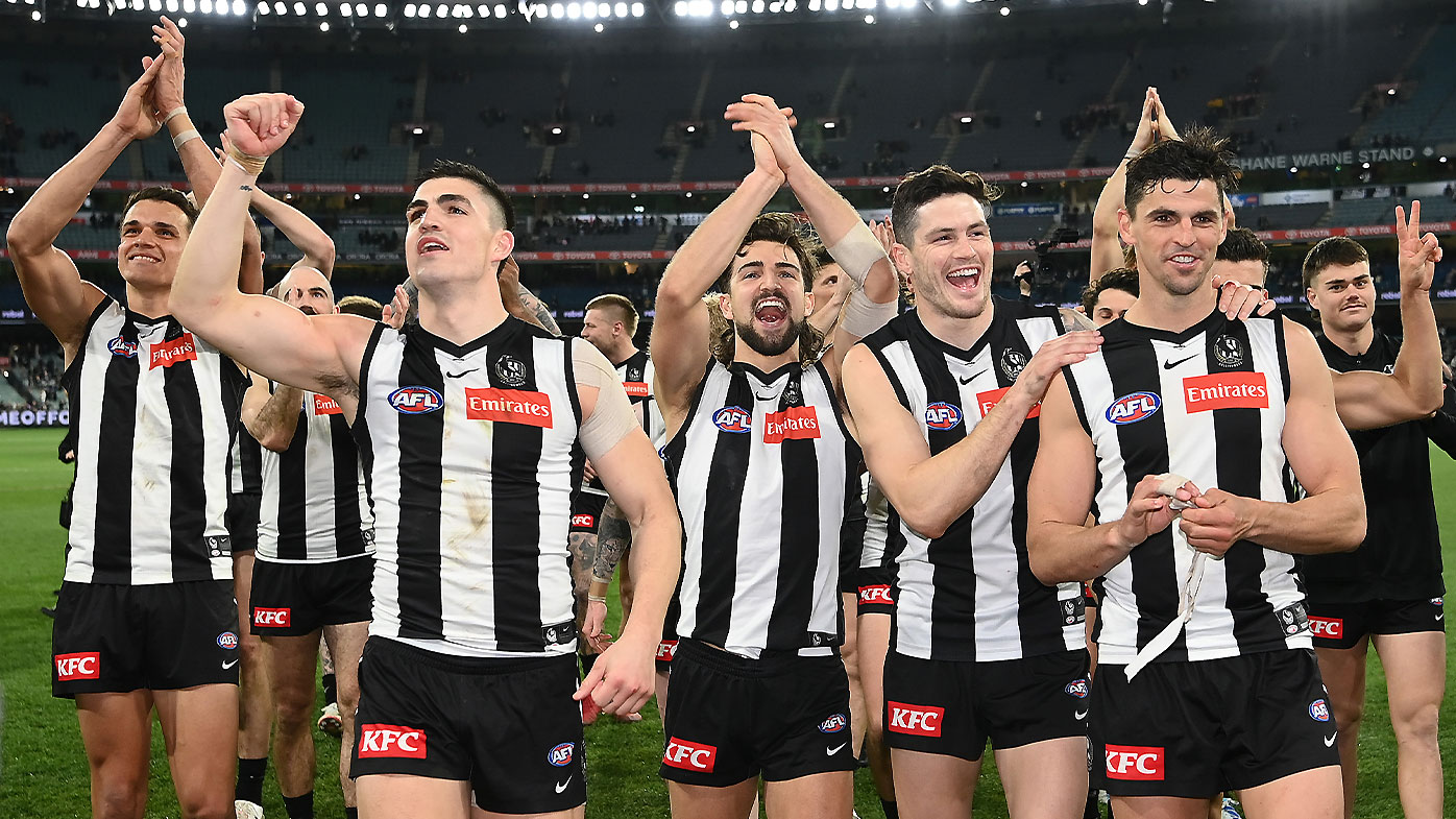 Collingwood players celebrate with the fans after their semi-final win over Fremantle