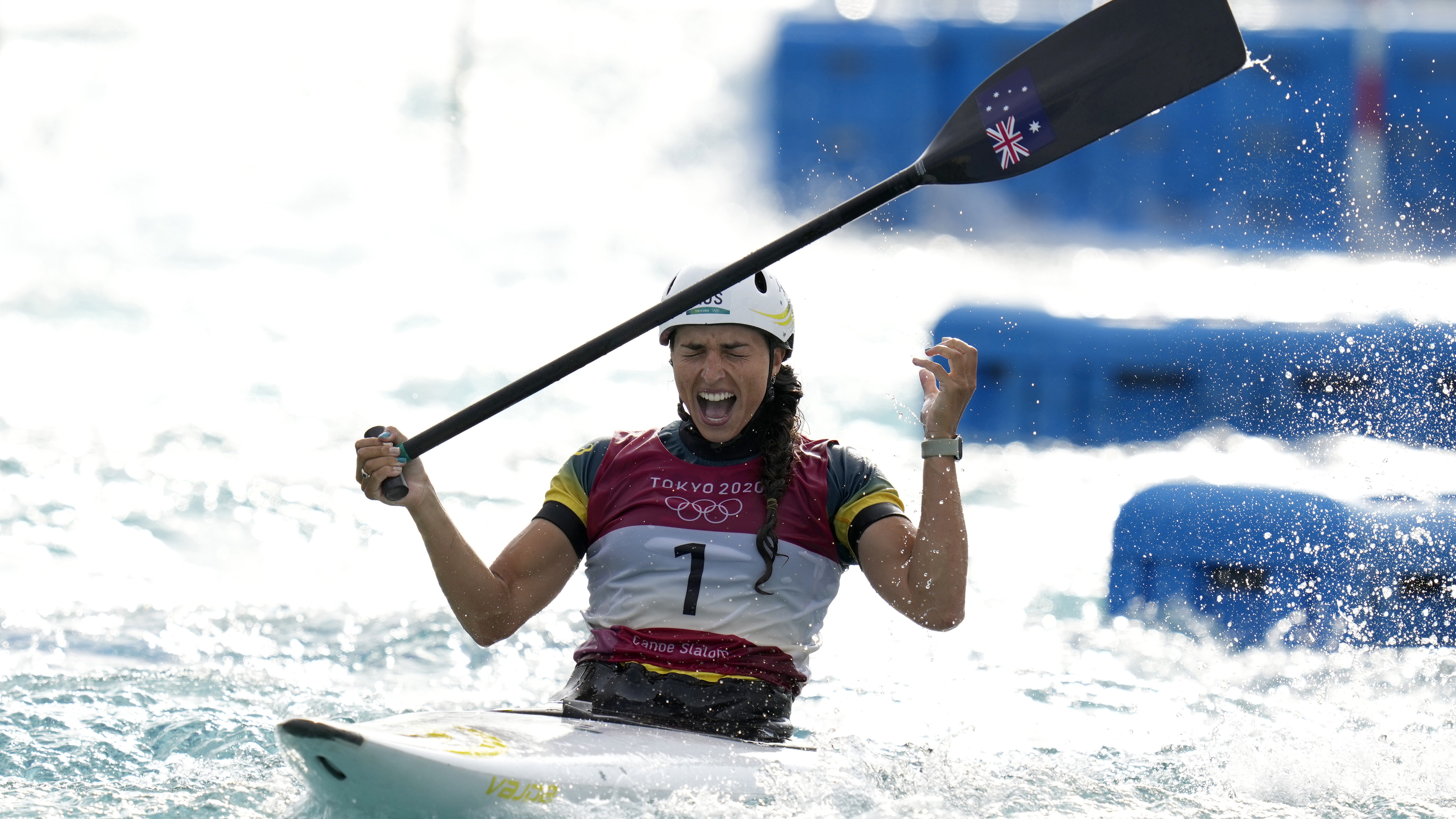 Jessica Fox of Australia celebrates as she crosses the finish line to win gold in the Women's C1 of the Canoe Slalom.