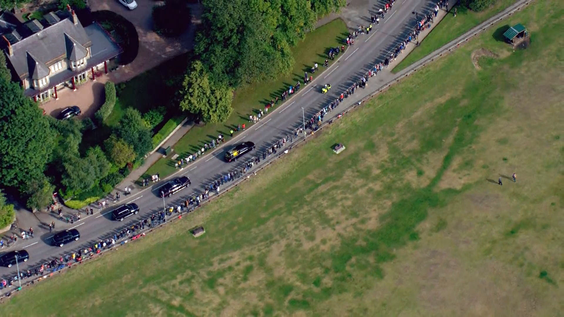 Crowds line the street as the Queen's coffin journeys through Aberdeenshire