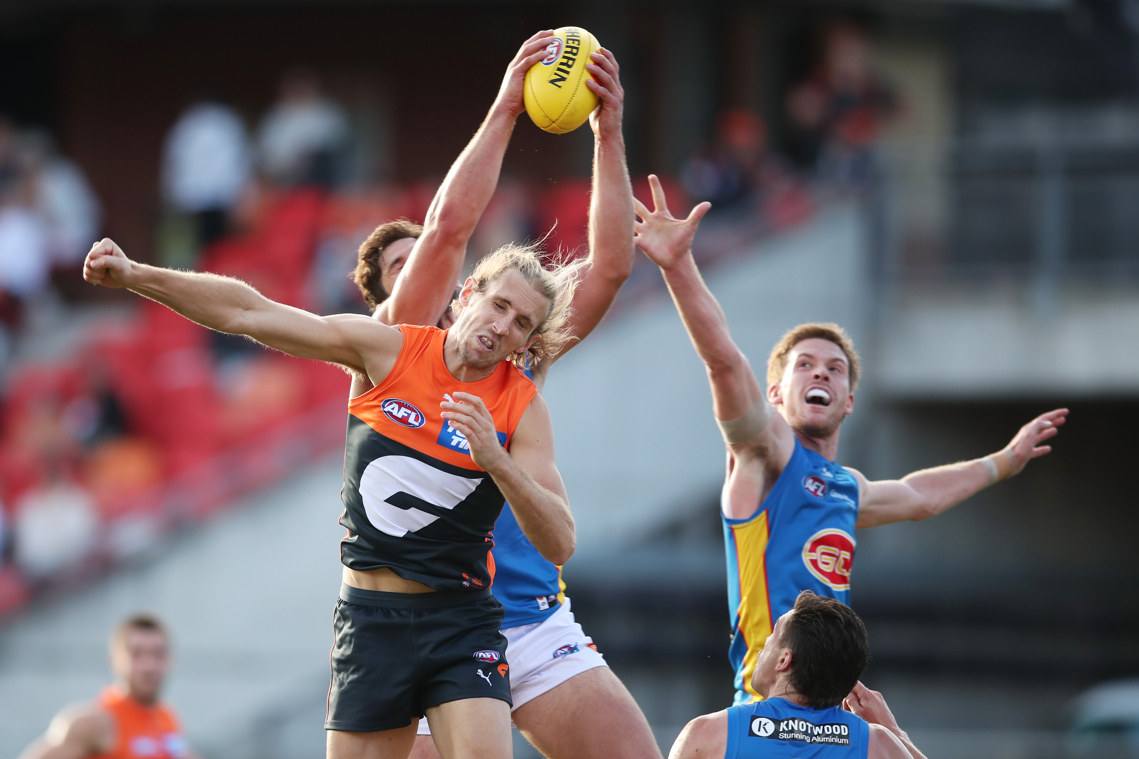 Giant Nick Haynes has a mark taken over him during the round three clash between the GWS Giants and the Gold Coast Suns.