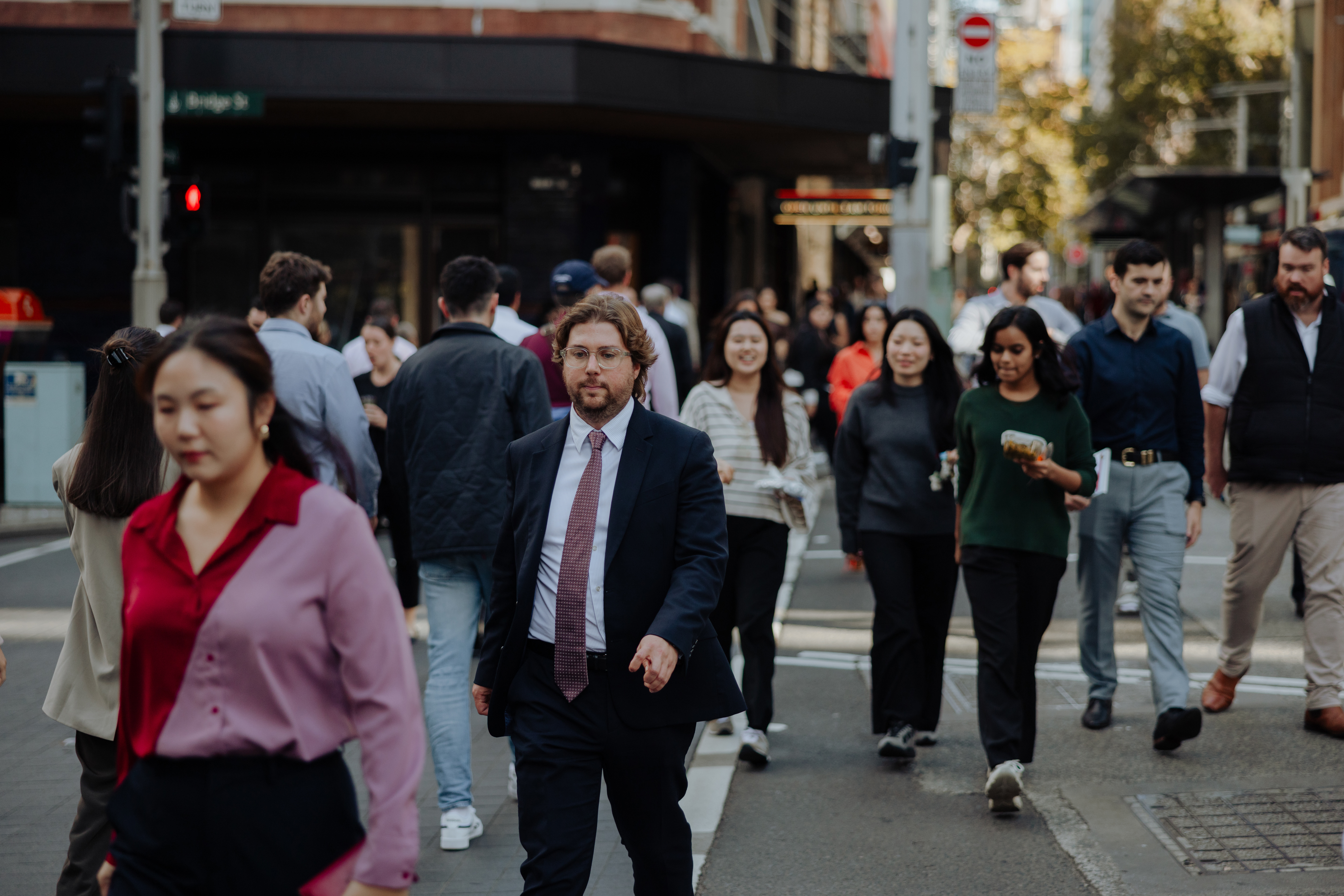 Pedestrians and office workers walk through the Sydney CBD. 