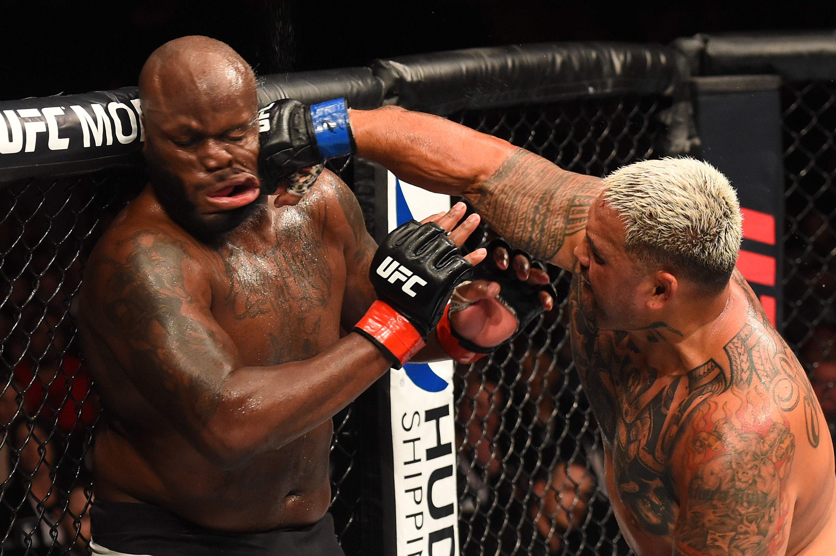 Mark Hunt of New Zealand punches Derrick Lewis at Spark Arena in Auckland.