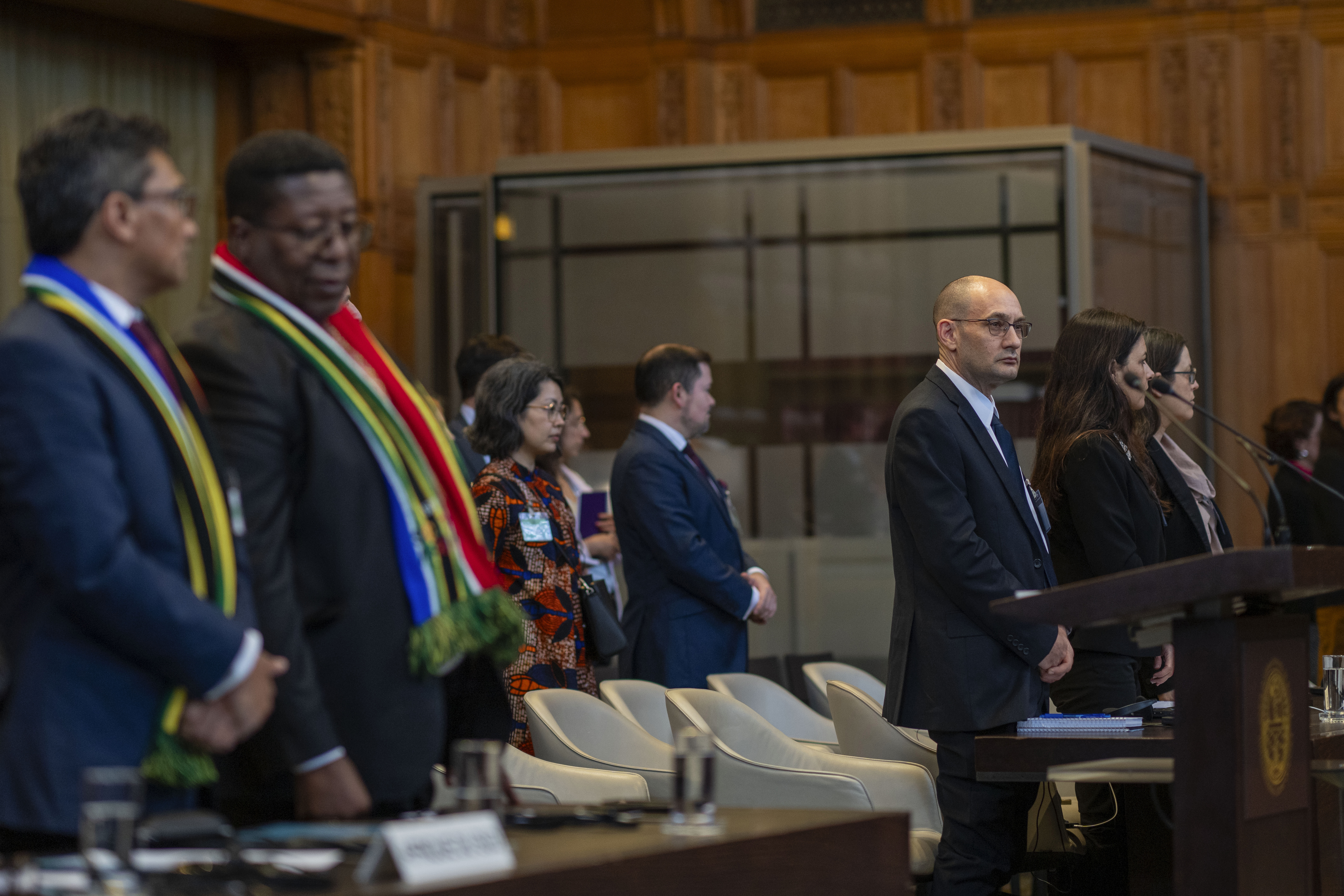 Front row from left, South Africa's agents Cornelius Scholtz, Vusimuzi Madonsela and Israel's agents Gilad Naom, Tamar Kaplan Tourgeman and co-agent Avigail Frisch Ben Avraham wait for the start of hearings at the International Court of Justice, in The Hague, Netherlands, Thursday, May 16, 2024. 