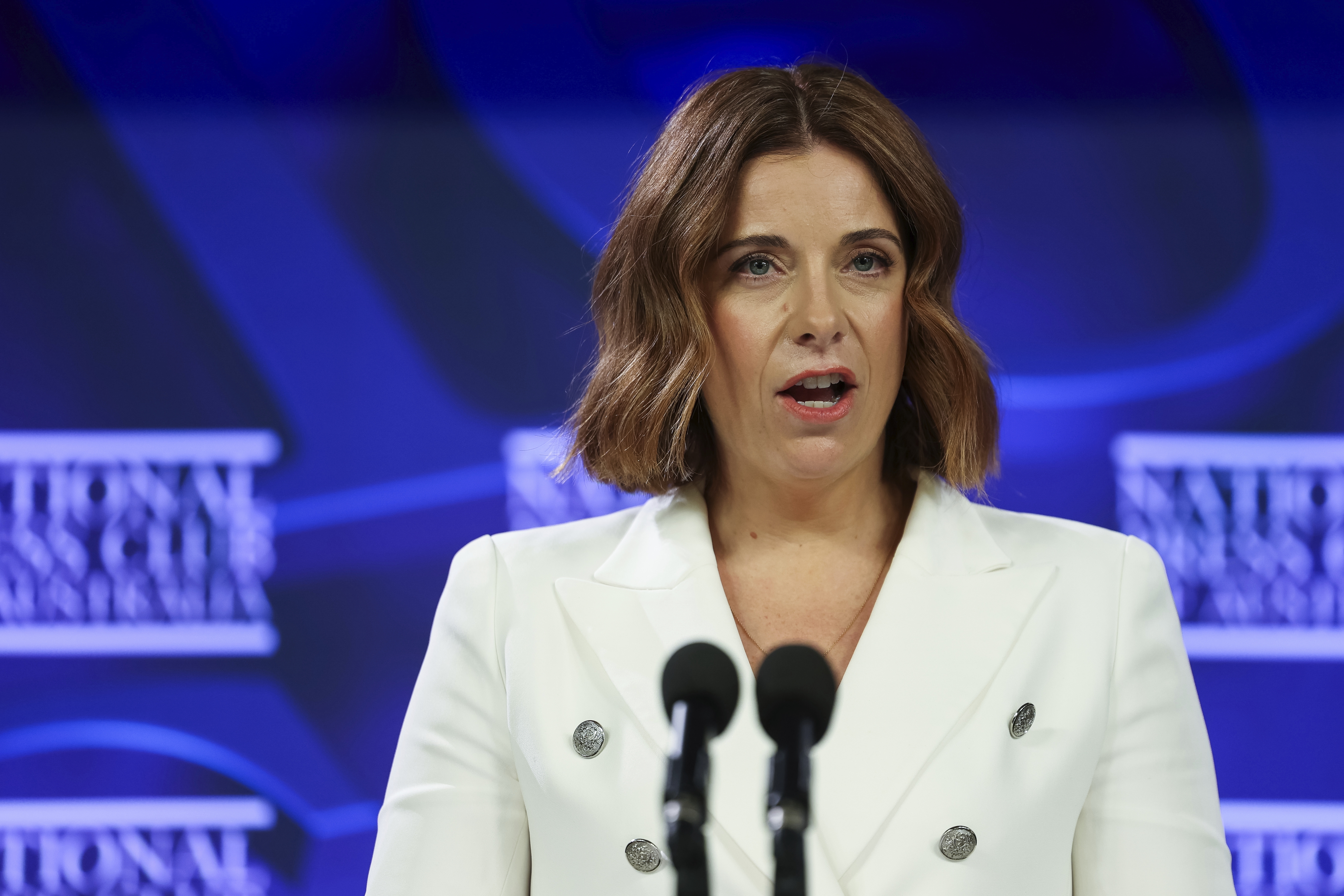 Minister for Communications and Minister for Sport Anika Wells during an address to the National Press Club of Australia in Canberra on Wednesday 3 December 2025. fedpol Photo: Alex Ellinghausen