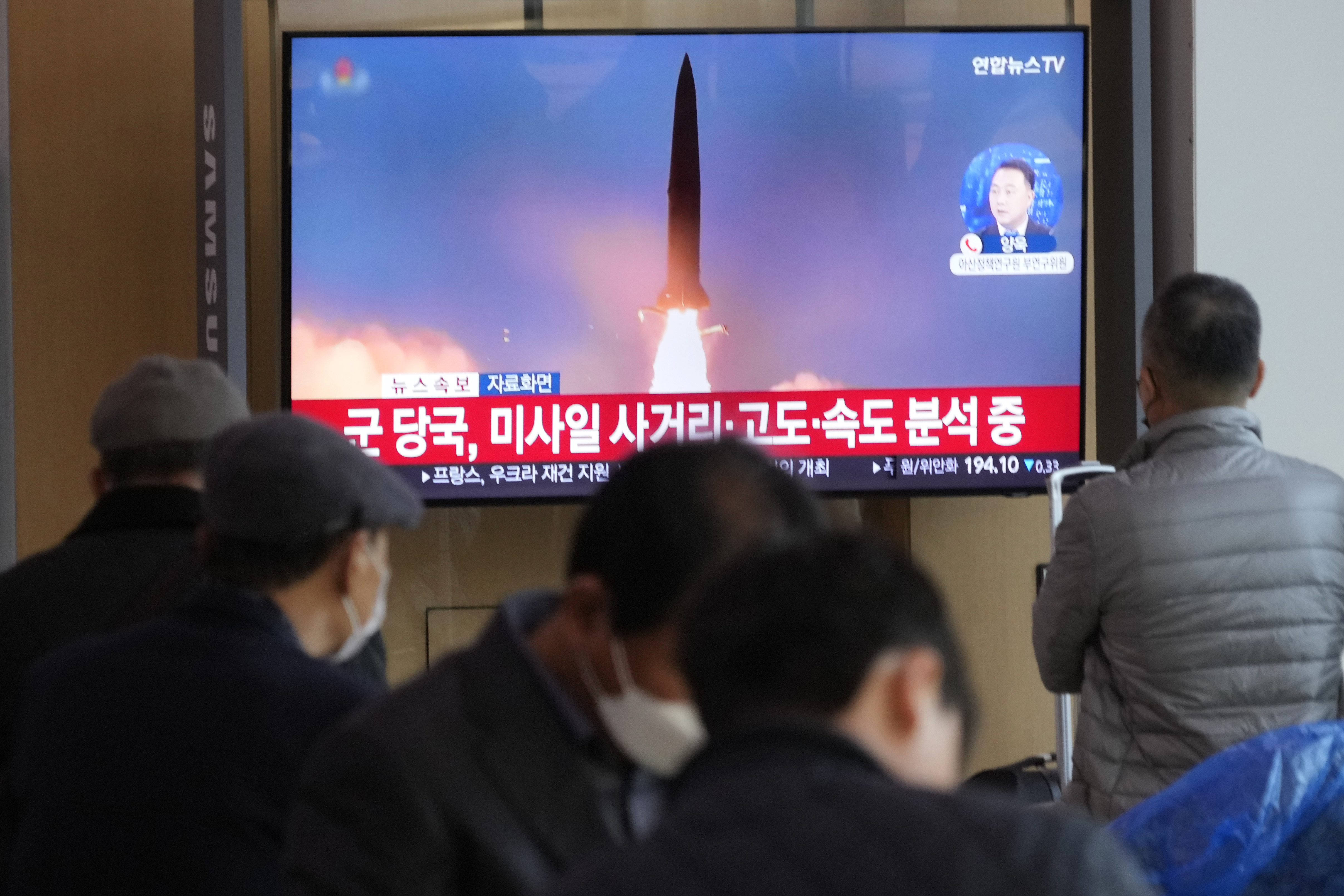 A TV screen shows a file image of North Korea's missile launch during a news program at the Seoul Railway Station in Seoul, South Korea, Wednesday, November 2, 2022. 