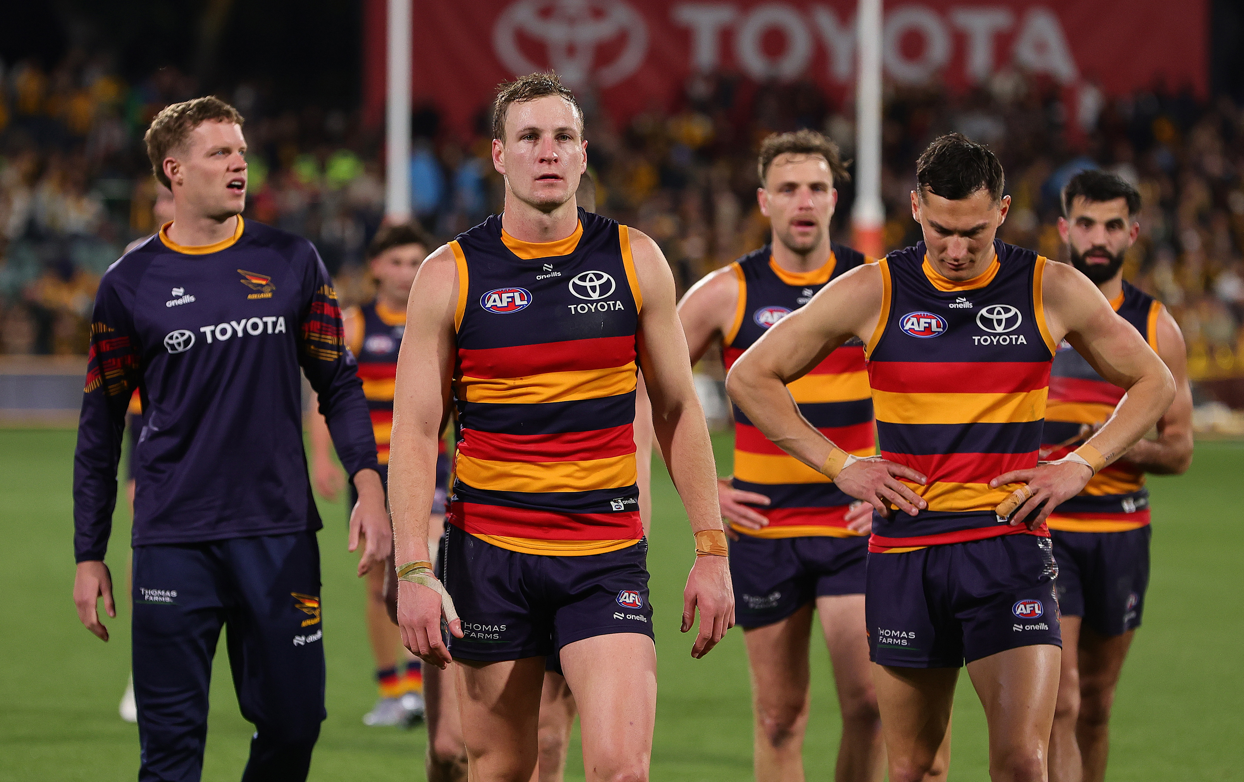 Crows captain Jordan Dawson  leads his team off the field after their semi-final defeat by the Hawks.
