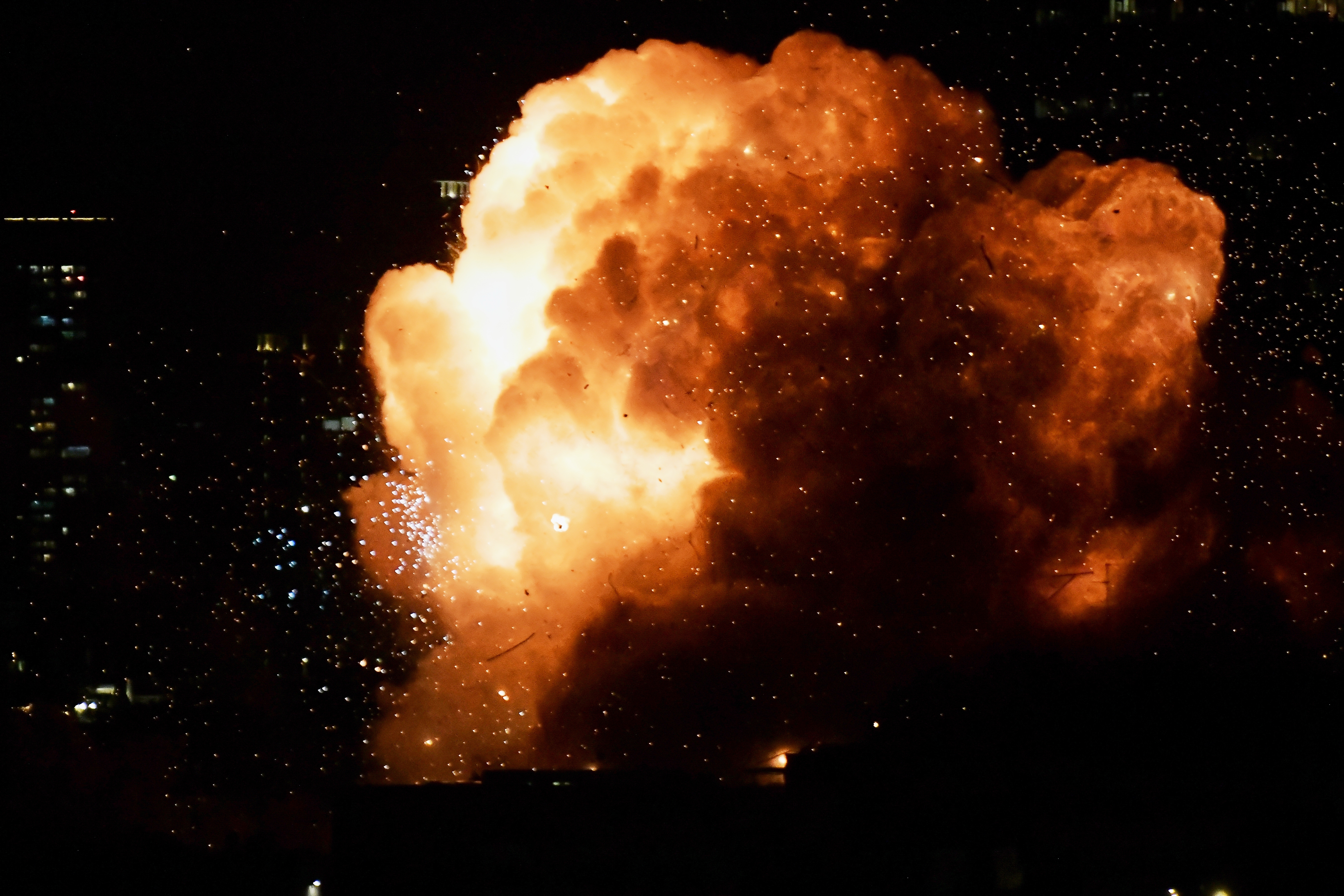 An explosion is seen as a missile hits a building in Tel Aviv, Israel, Saturday, Feb. 28, 2026.