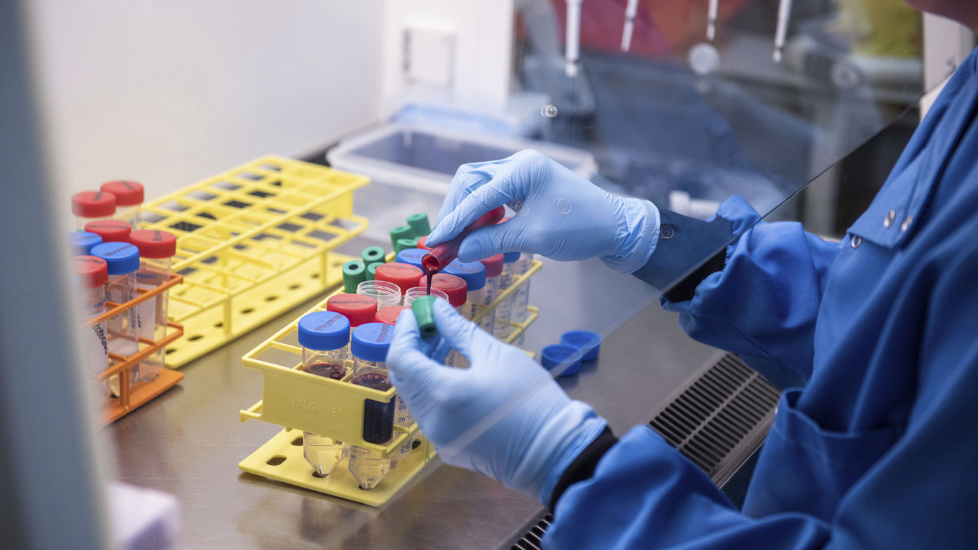 A researcher in a laboratory at the Jenner Institute in Oxford, England, works on the coronavirus vaccine developed by AstraZeneca and Oxford University.