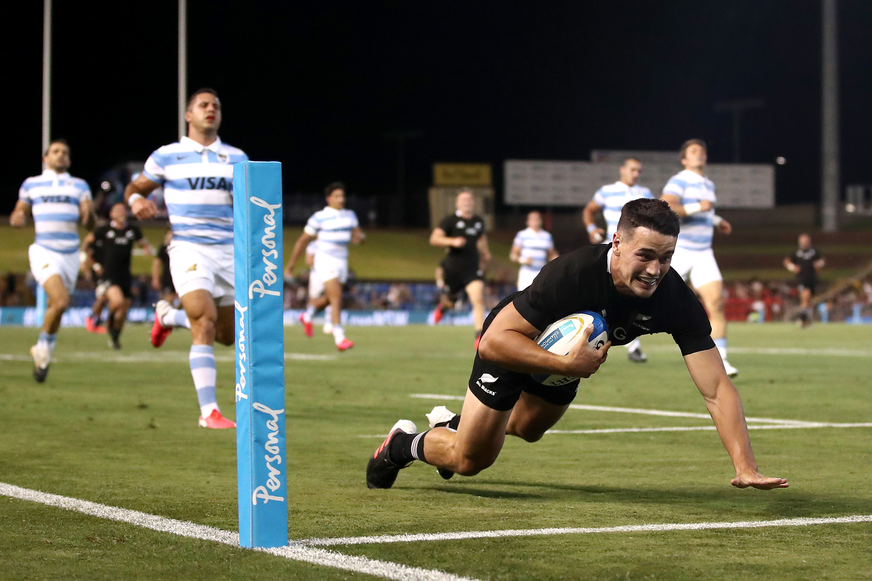 Will Jordan of the All Blacks makes a break to score a try.
