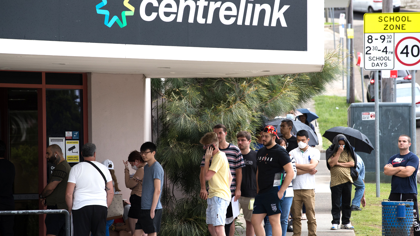 People queue up at Centrelink in Rockdale, Sydney after many people have lost their jobs due to the coronavirus lockdowns