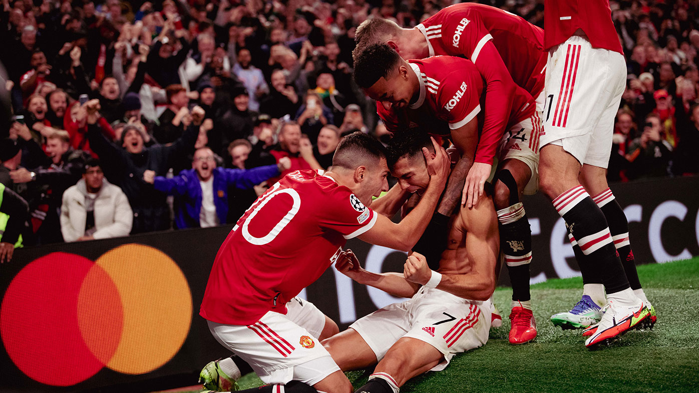 Cristiano Ronaldo of Manchester United celebrates scoring a goal to make the score 2-1 with his team-mates during the UEFA Champions League group F match between Manchester United and Villarreal CF at Old Trafford on September 29, 2021 in Manchester, United Kingdom. (Photo by Ash Donelon/Manchester United via Getty Images)