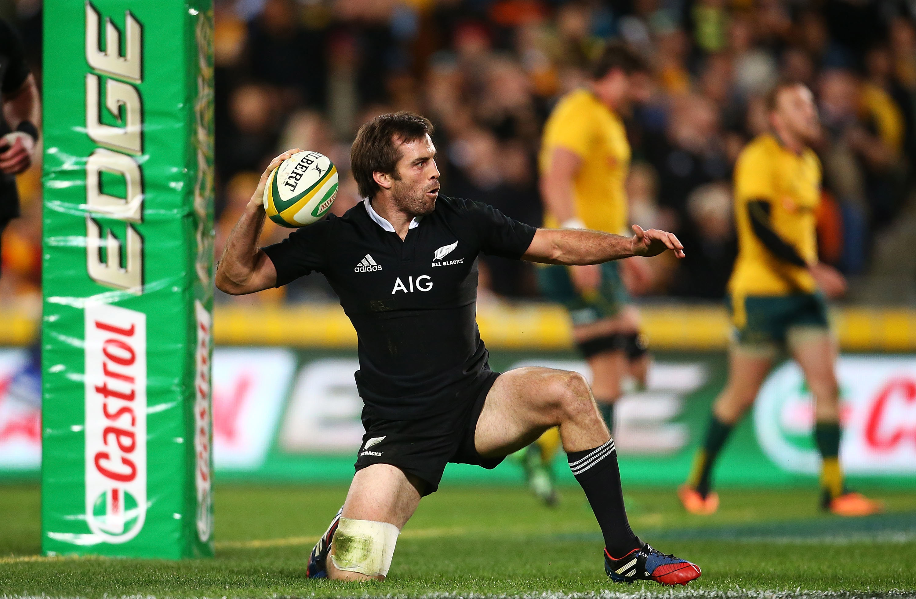 Conrad Smith of the All Blacks celebrates scoring a try.