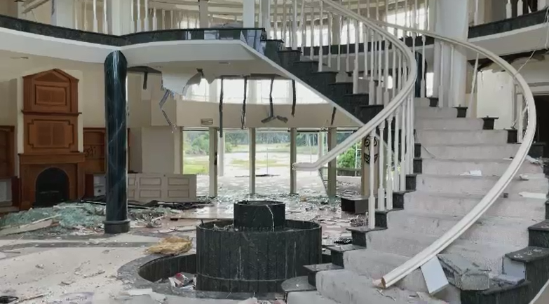 The multi-million-dollar Nerang mansion, now labelled as a "disgrace" by residents, has had its windows, walls and ceilings smashed and destroyed and is covered in graffiti. 