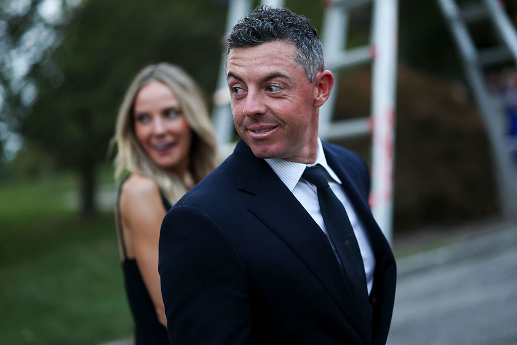 Rory McIlroy of Team Europe and wife Erica Stoll McIlroy arrive for the Ryder Cup Teams' Welcome Dinner prior to the Ryder Cup 2025