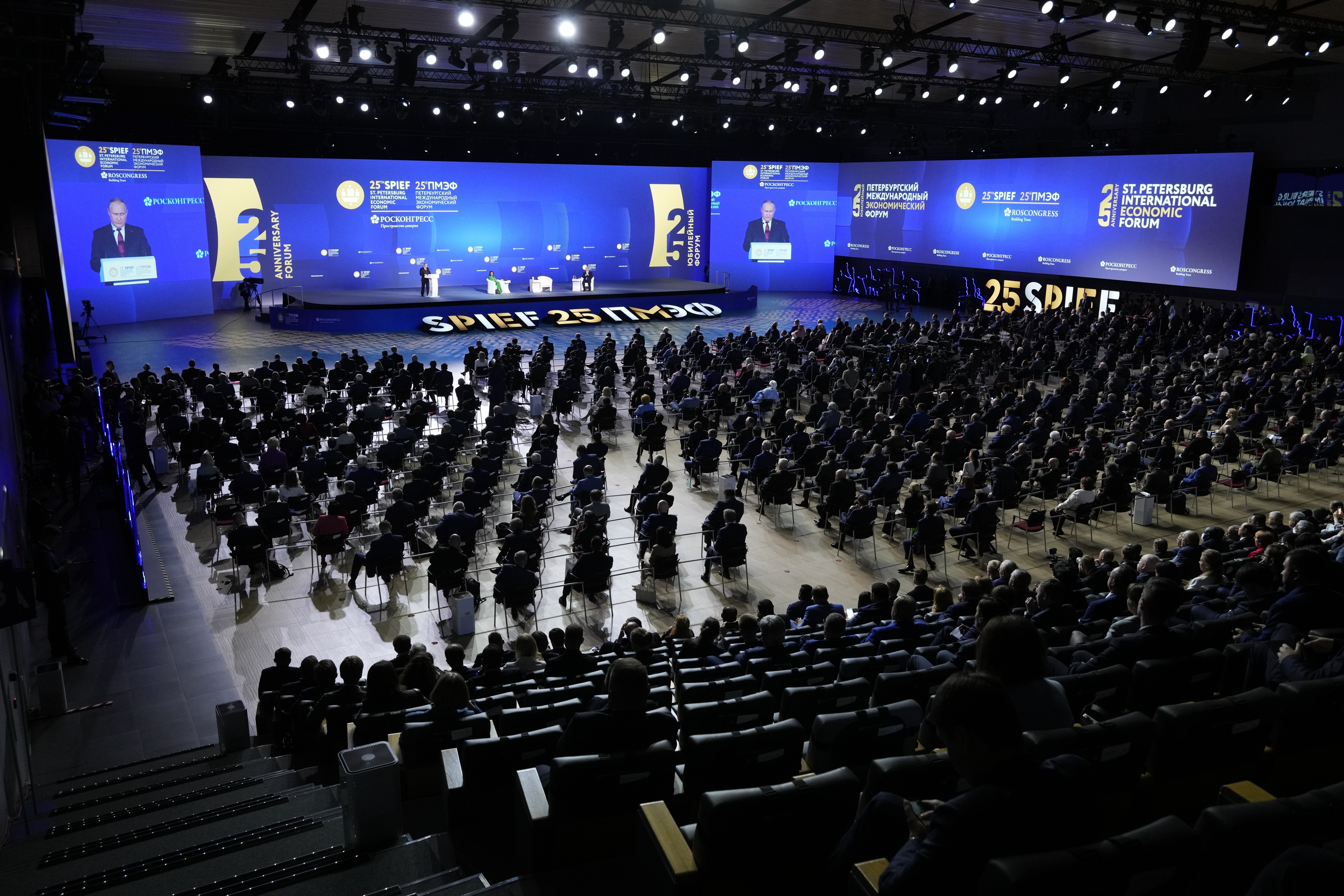Russian President Vladimir Putin, left, Margarita Simonyan, the head of the Russian television channel RT, center, and Kazakhstan's President Kassym-Jomart Tokayev attend a plenary session of the St. Petersburg International Economic Forum in St.Petersburg, Russia, Friday, June 17, 2022. Putin began his address to the St. Petersburg International Economic Forum with a lengthy denunciation of countries that he contends want to weaken Russia, including the United States who, he said, "declared vic