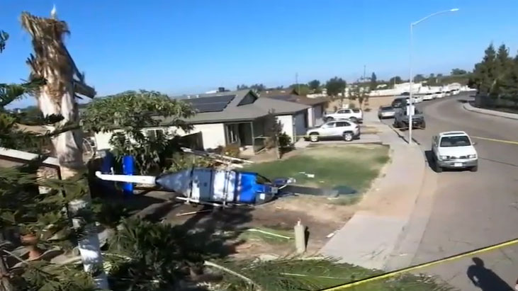 A pilot and passenger have been injured after a helicopter crashed into the front yard of a home in California.