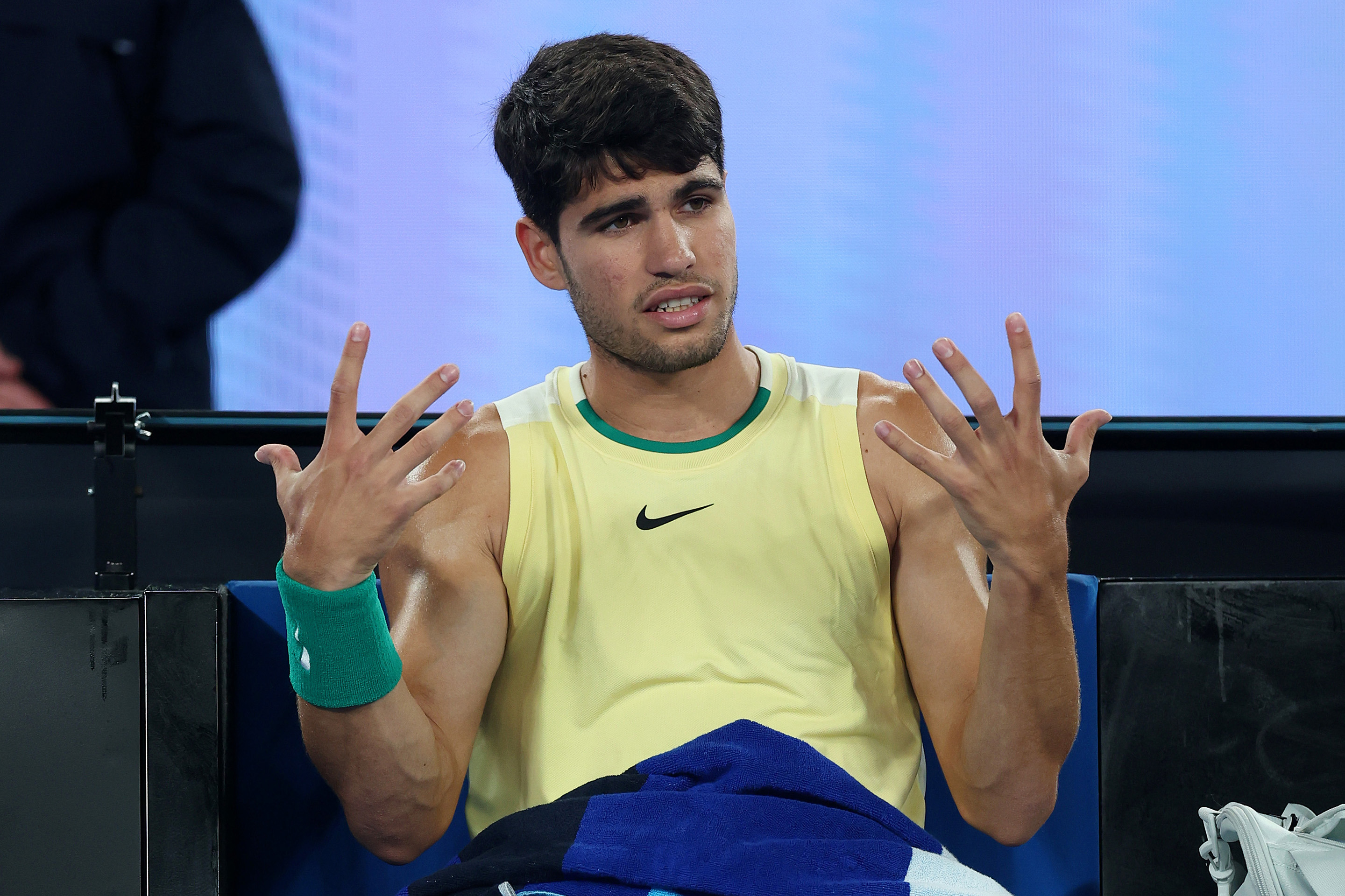 Carlos Alcaraz of Spain reacts to his player's box during their quarterfinals singles match against Alexander Zverev of Germany during the 2024 Australian Open.