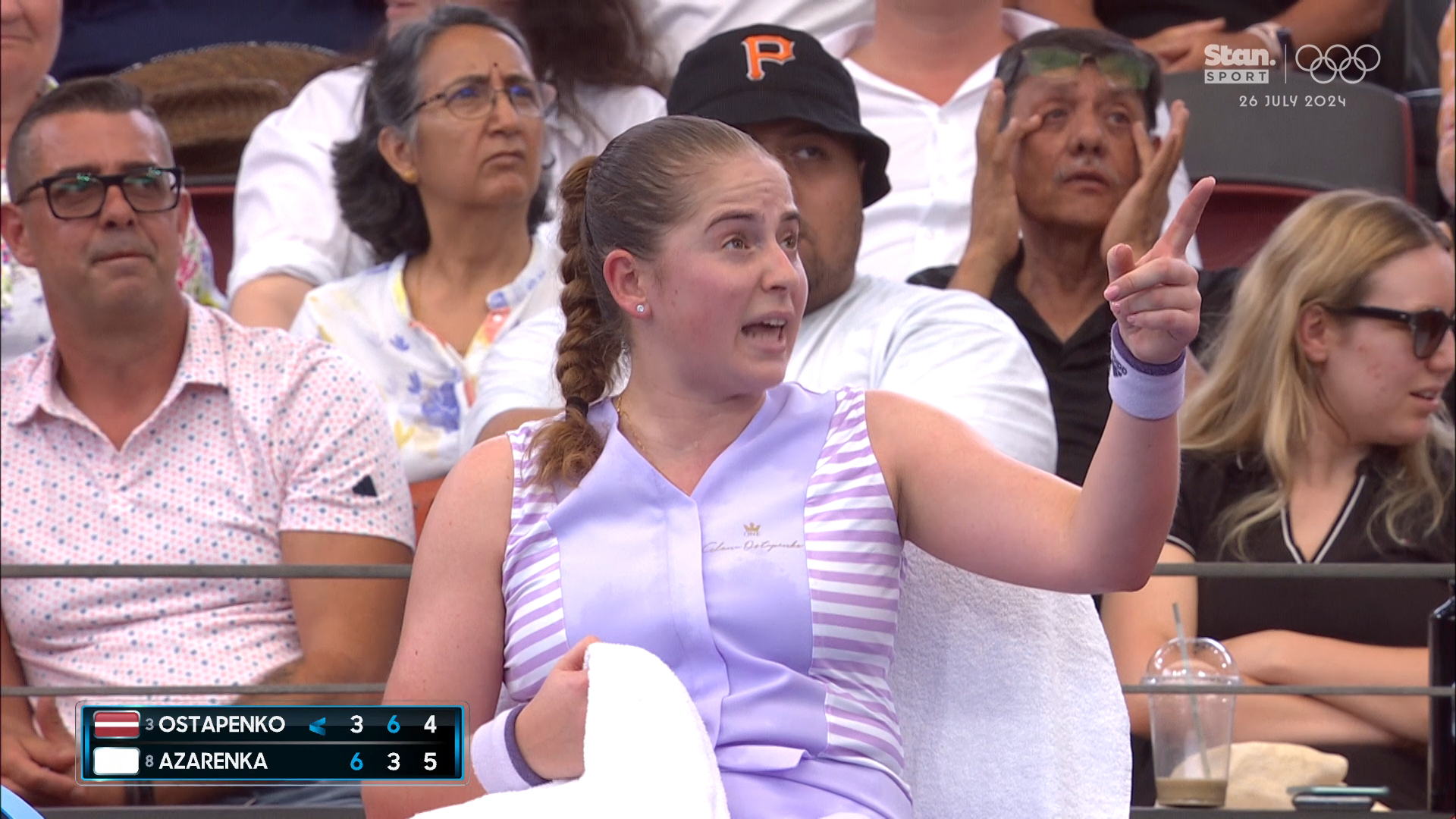 Jelena Ostapenko argues with the chair umpire after a call did not fall in her favour.