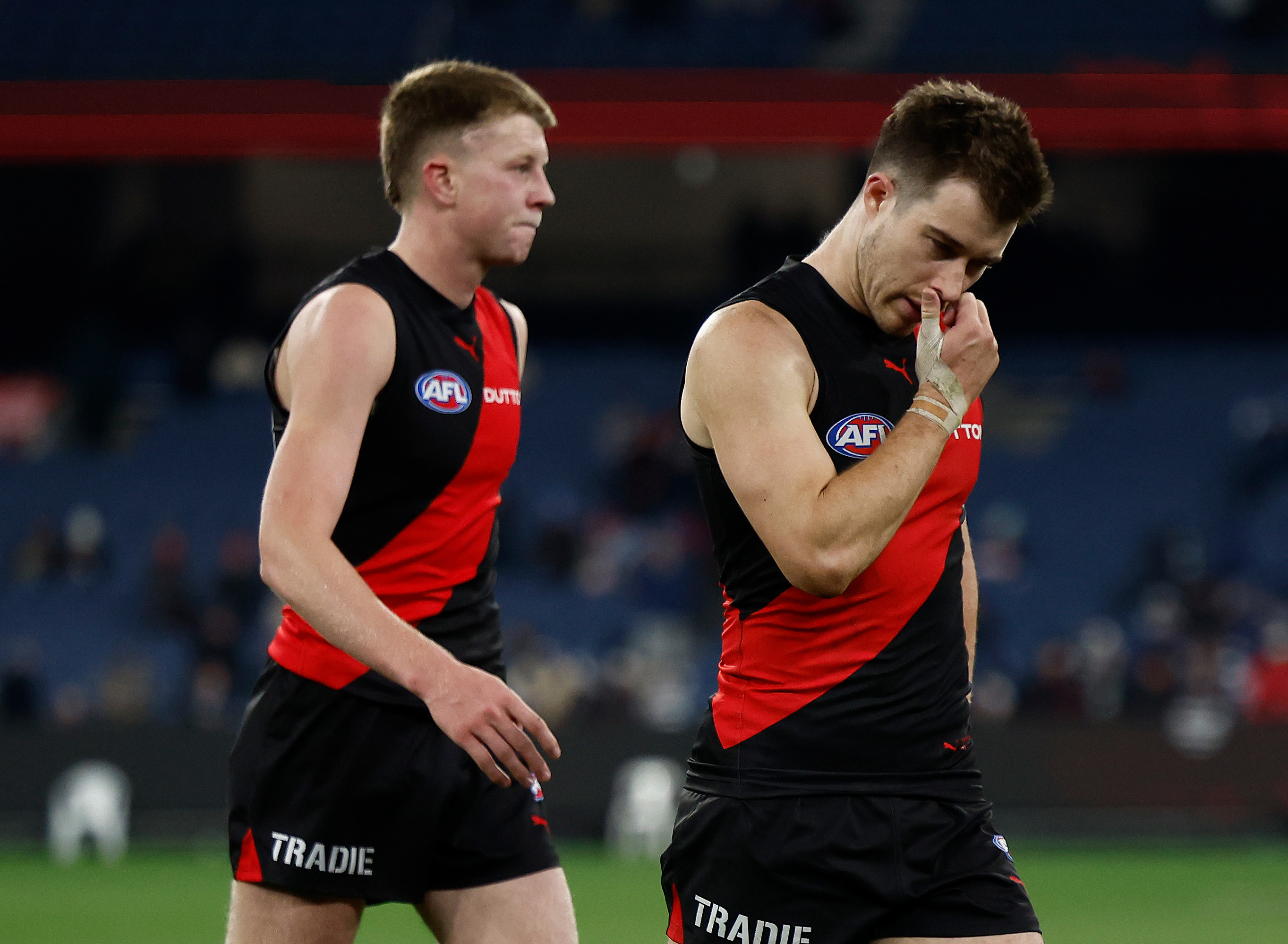 Zach Merrett of the Bombers looks dejected after a loss.