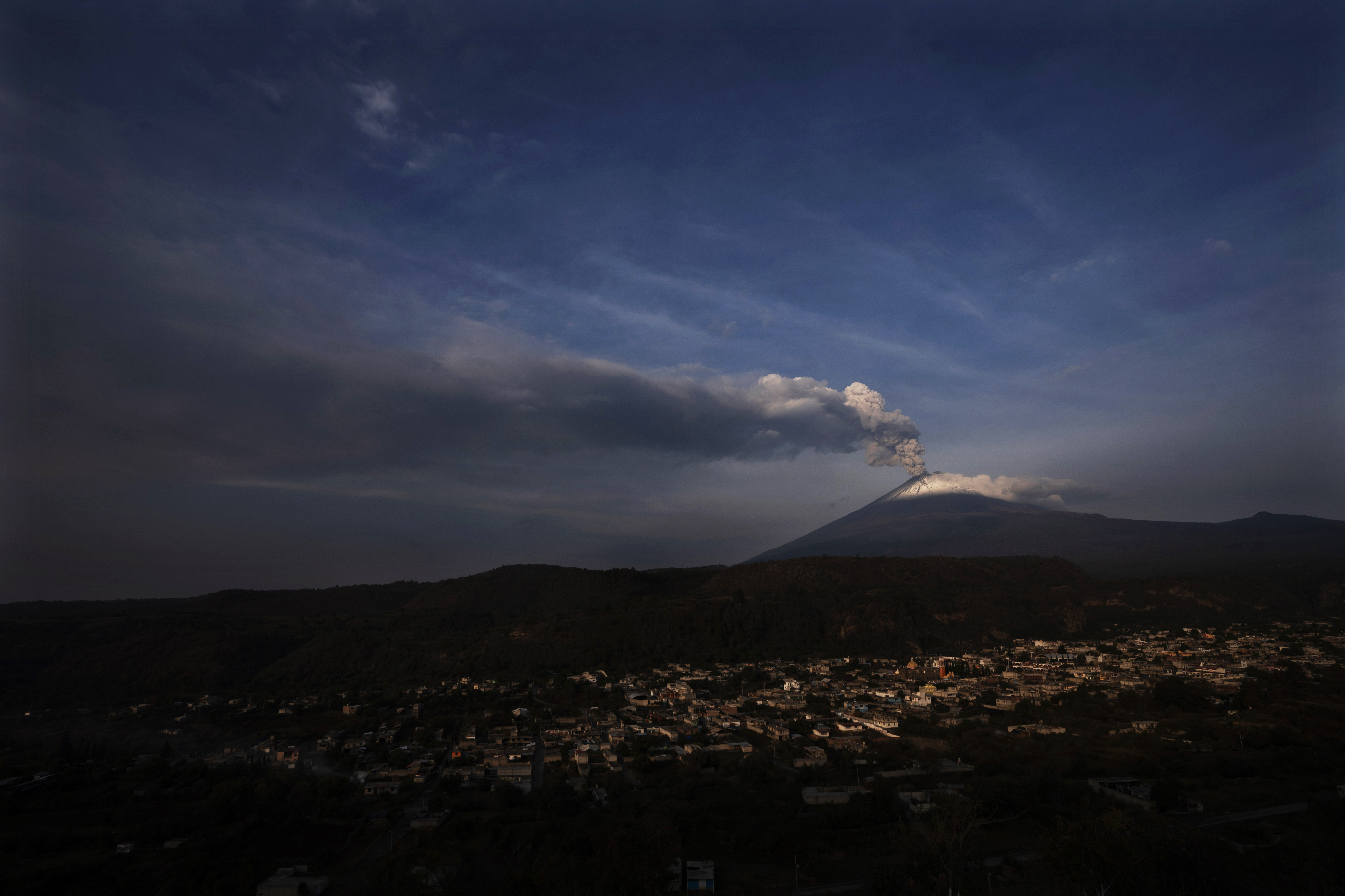 The Popocatepetl volcano spews ash and steam, seen from Santiago Xalitzintla, Mexico, Wednesday, May 24, 2023 