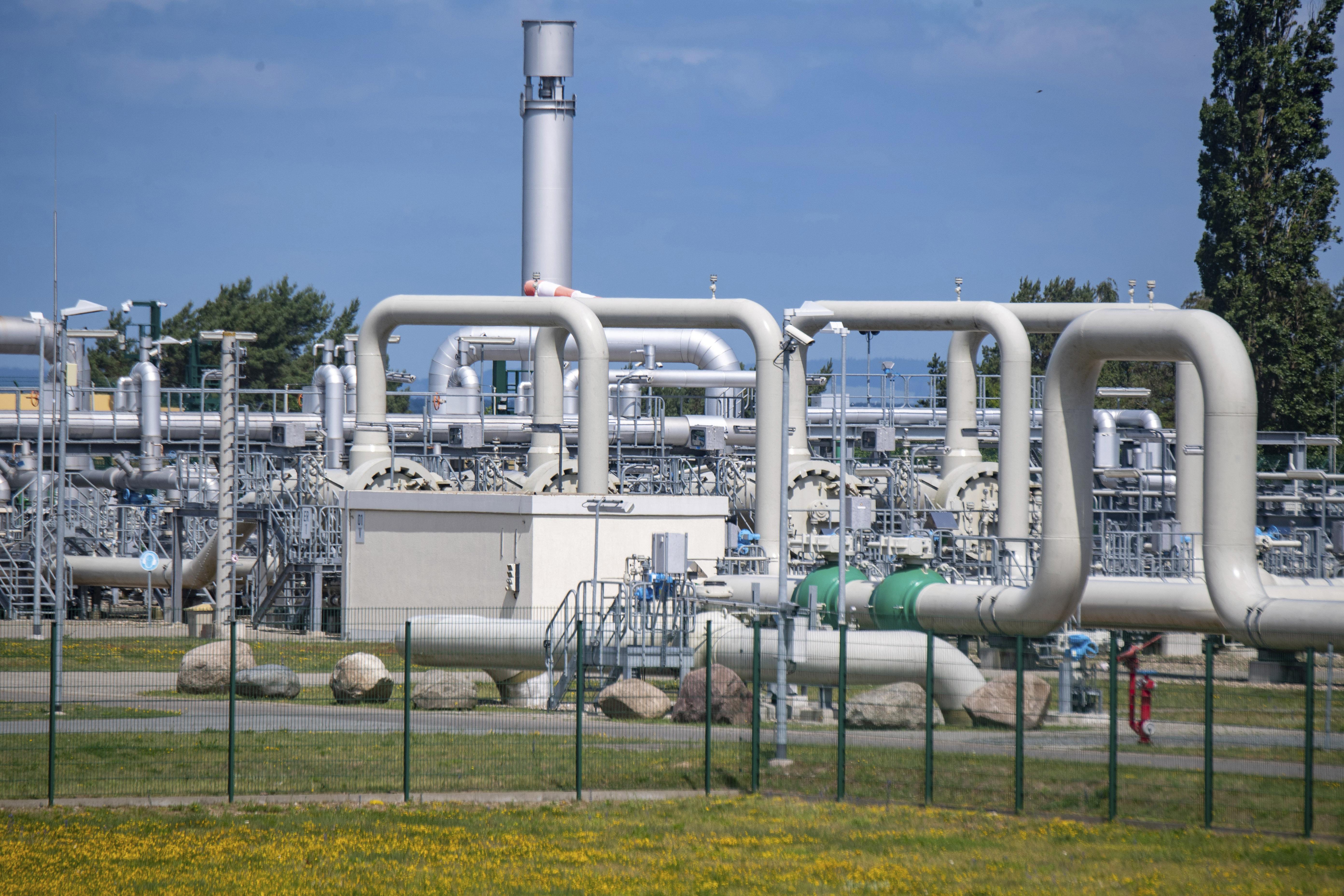 FILE - A view of pipe systems and shut-off devices at the gas receiving station of the Nord Stream 1 Baltic Sea pipeline and the transfer station of the OPAL (Ostsee-Pipeline-Anbindungsleitung - Baltic Sea Pipeline Link) long-distance gas pipeline in Lubmin, Germany, June 21, 2022. The Canadian government said late Saturday, July 9, 2022 it will allow the delivery to Germany of equipment from a key Russia-Europe gas pipeline that has undergone maintenance  equipment whose absence Russia's Gazpro