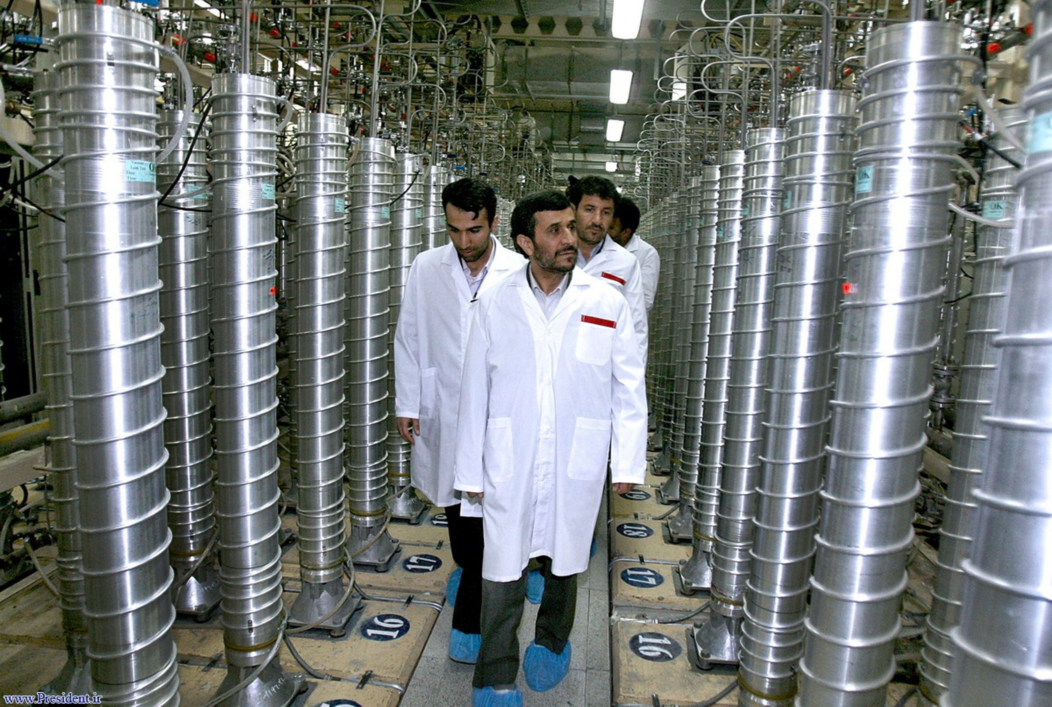 In this photo released by the Iranian President's Office, then-Iranian President Mahmoud Ahmadinejad, center, visits the Natanz Uranium Enrichment Facility near Natanz, Iran, April 8, 2008.