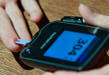 Person with type 1 diabetes tests blood sugar level (Getty)