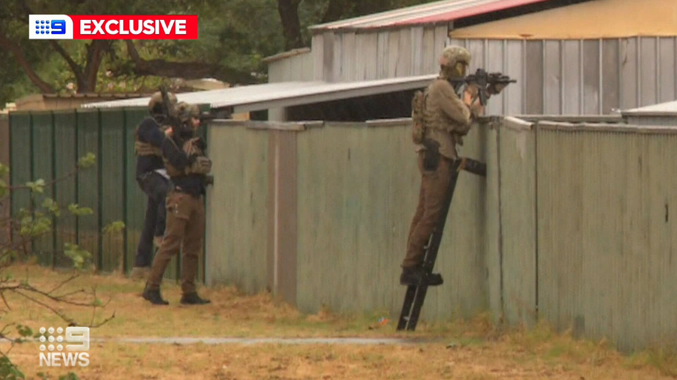 Nine News cameras captured the moment armed TRG officers stormed a home in Armadale bringing to an end a dramatic four day manhunt.