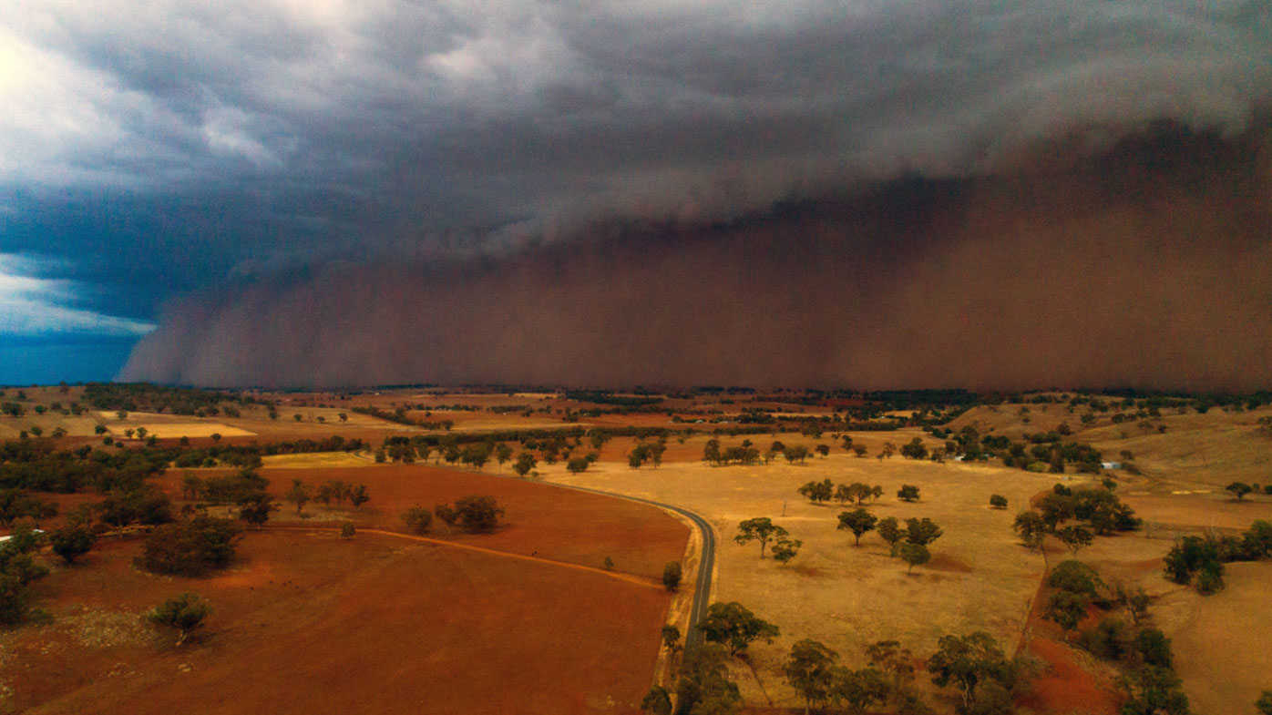 A dust storm rolls in west of Orange, NSW, on Sunday.