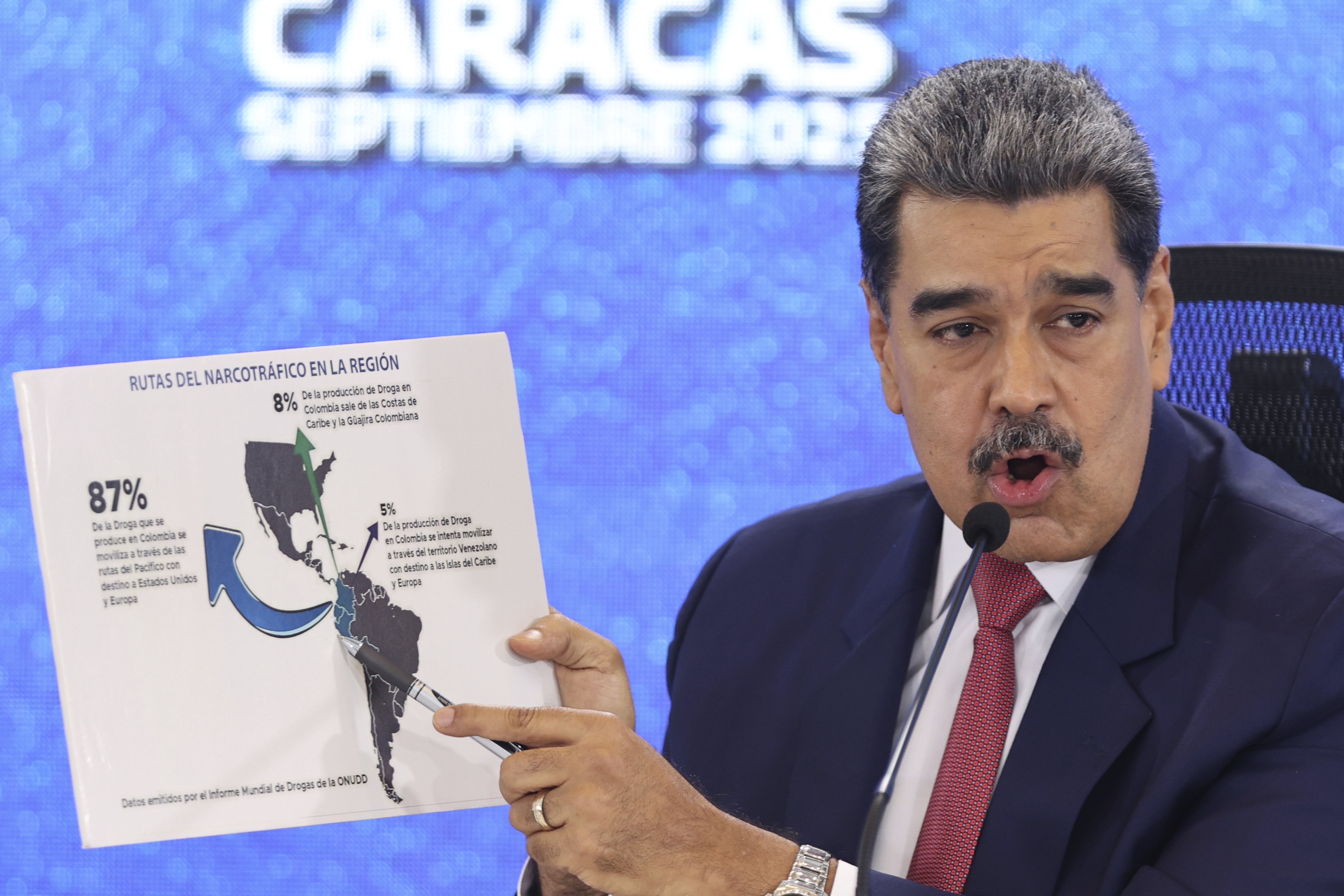 Venezuelan President Nicolas Maduro points at a map of the Americas during a press conference in Caracas, Venezuela, Monday, Sept 15, 2025. (AP Photo/Jesus Vargas)