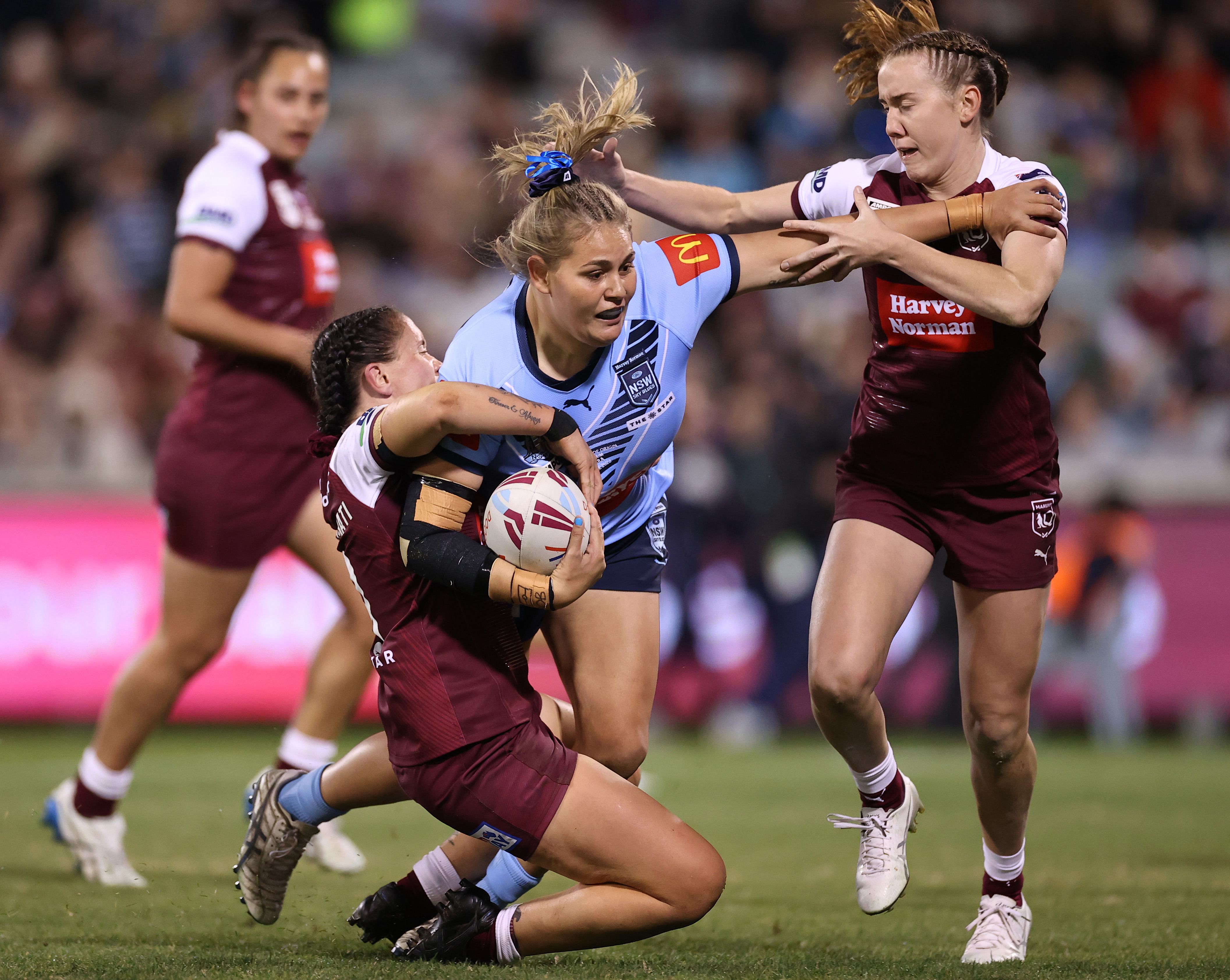 Caitlan Johnston of the Blues is tackled.