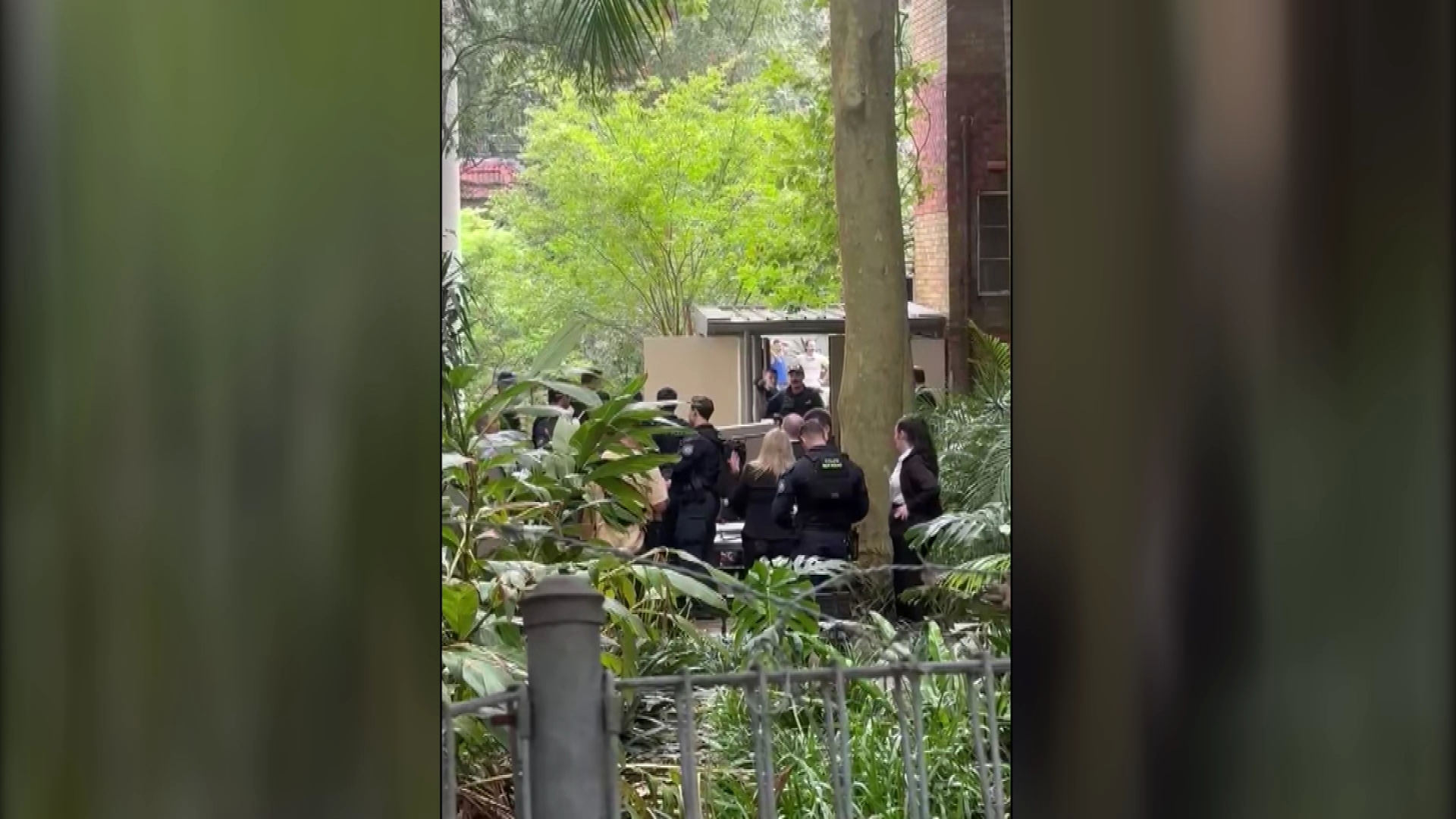 A street in the exclusive suburb of Potts Point remains closed after two women were injured inside their own apartment block.