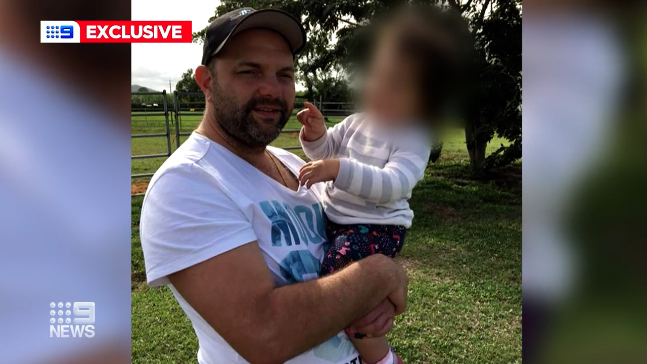 Carlo Trimboli with one of his children.