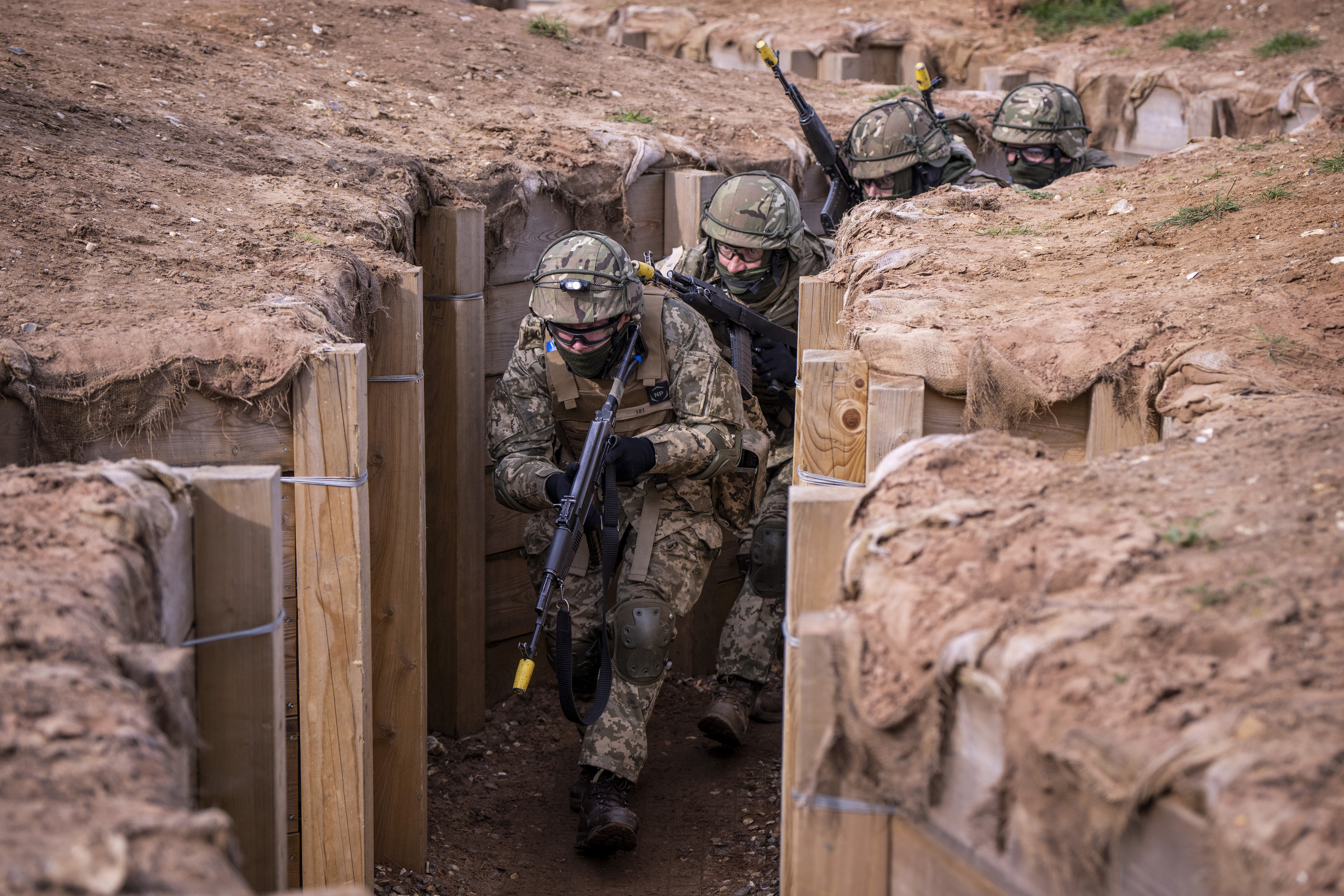 Ukrainian recruits are trained by members of the Danish military, in the east of England, Thursday, March 14, 2024. (Bo Amstrup/Ritzau Scanpix via AP)