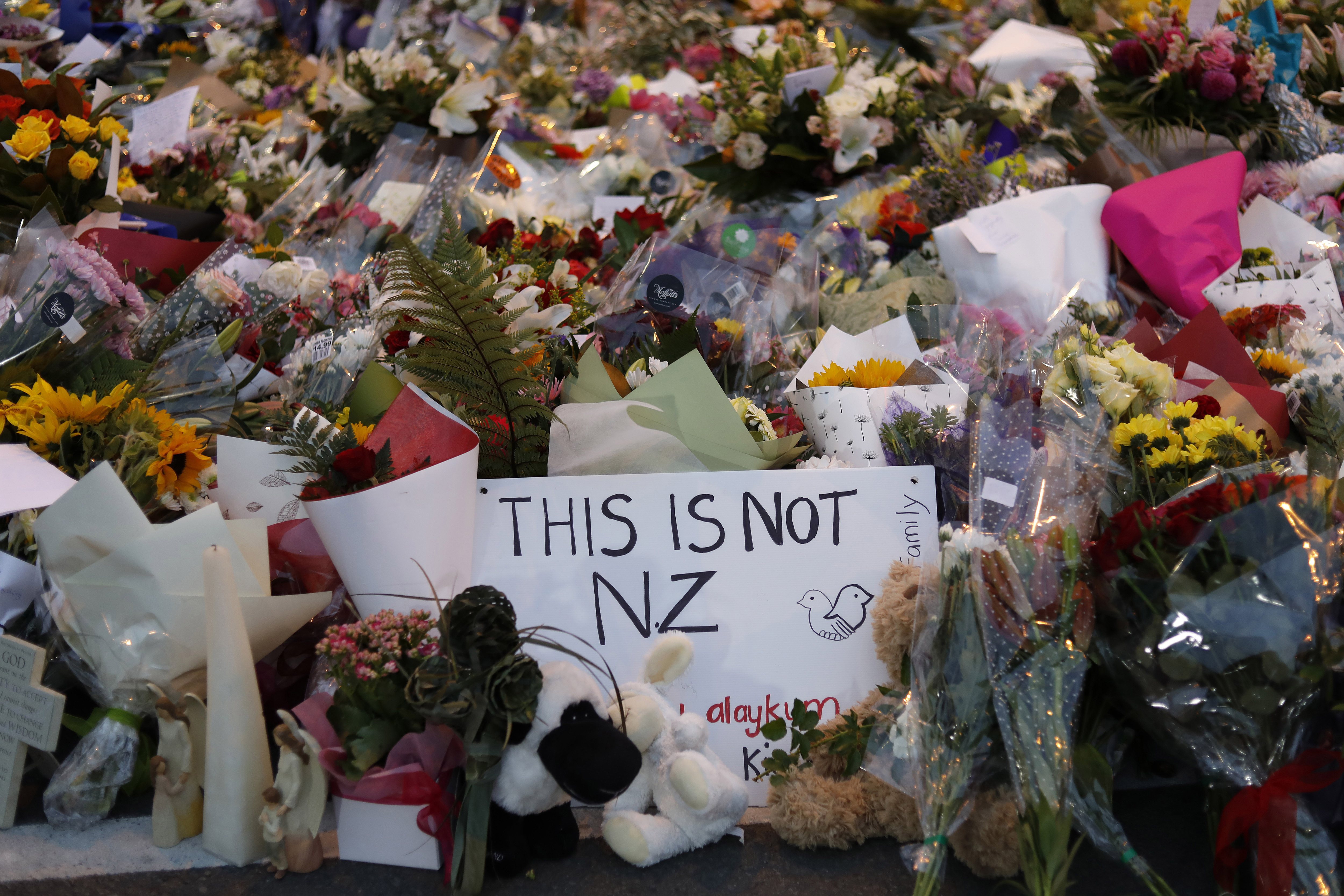 Flowers lay at a memorial near the Masjid Al Noor mosque for victims the day after the shooting.