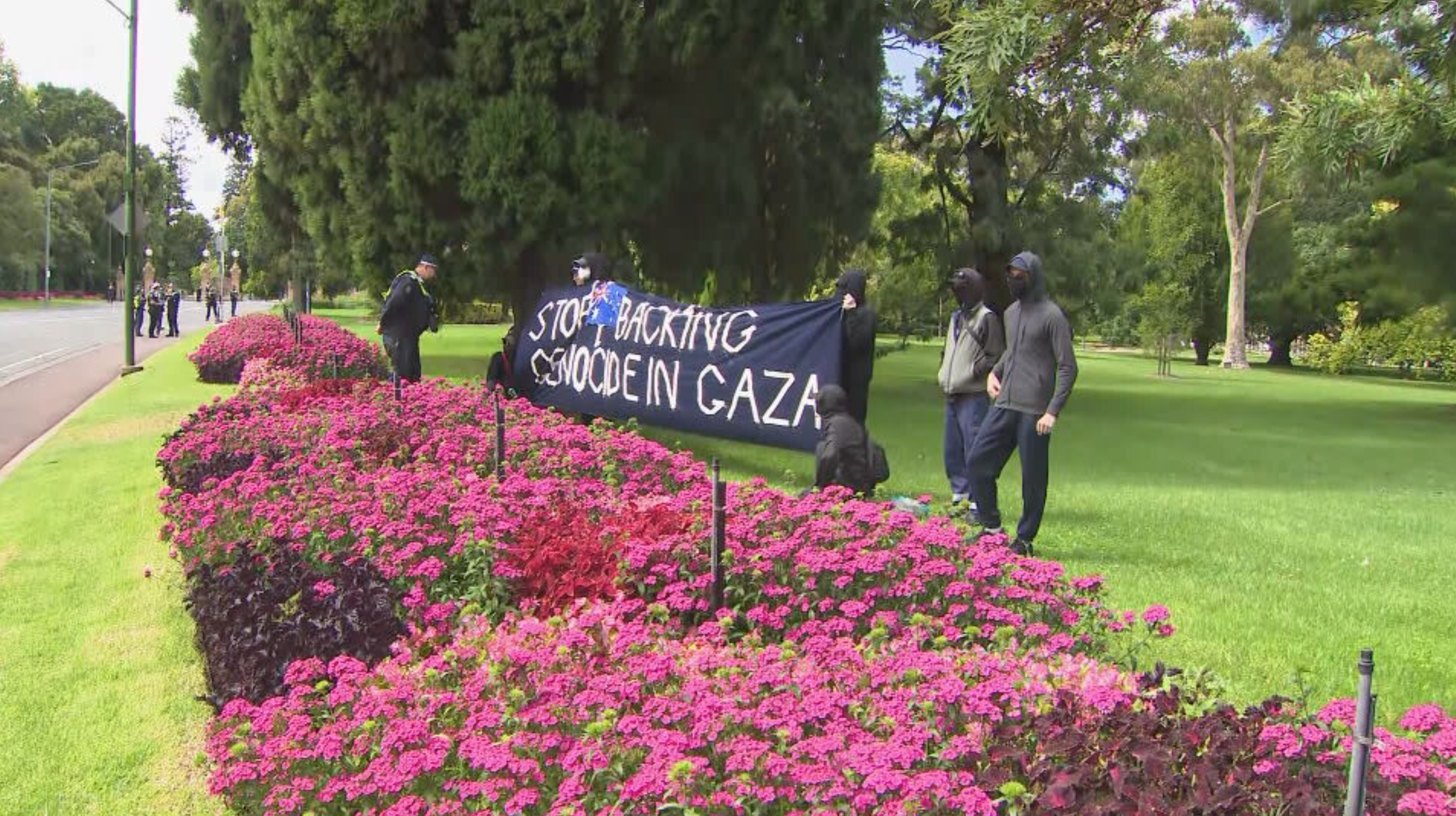 Police quickly moved on a small protest outside Government House during the President's visit.