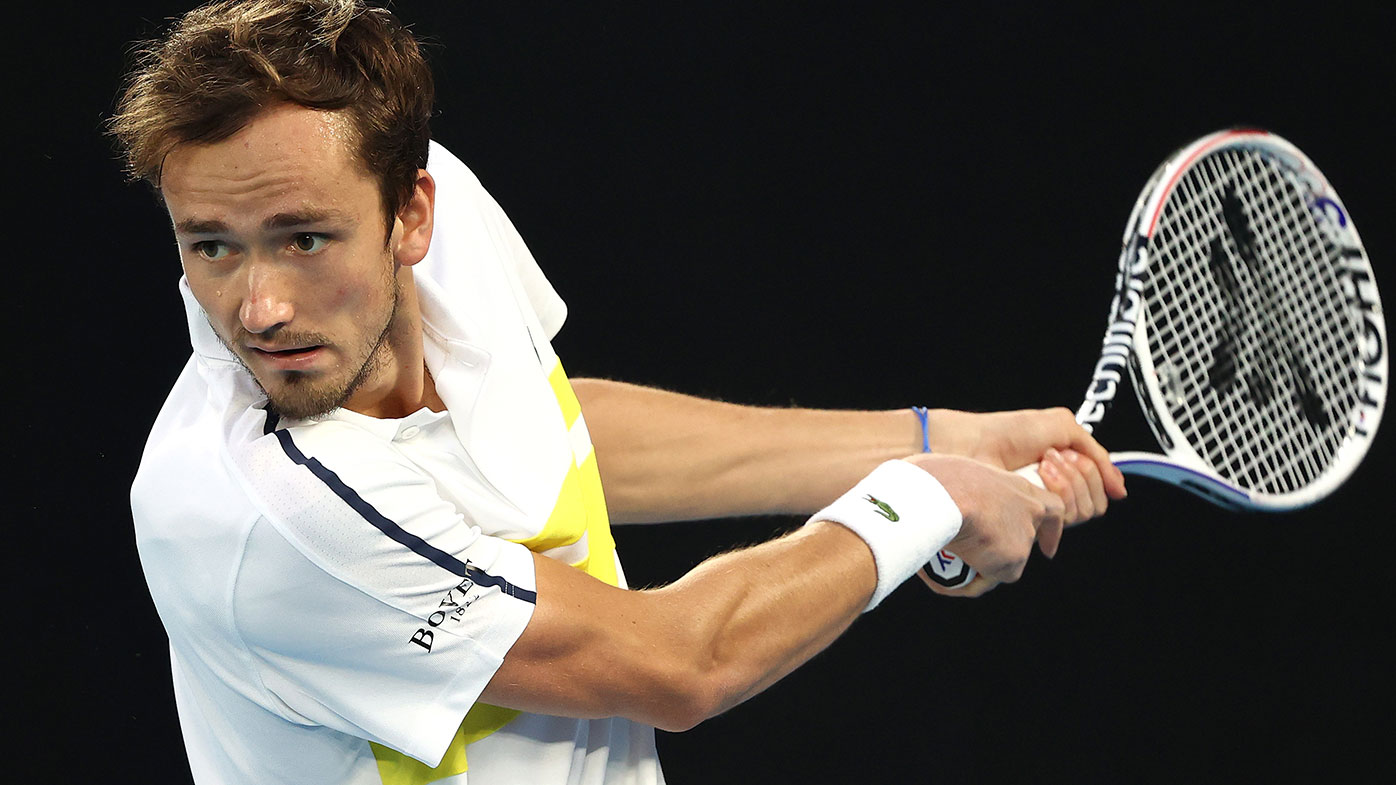 Daniil Medvedev of Russia plays a backhand in his Men's Singles Final match against Novak Djokovic of Serbia during day 14 of the 2021 Australian Open at Melbourne Park