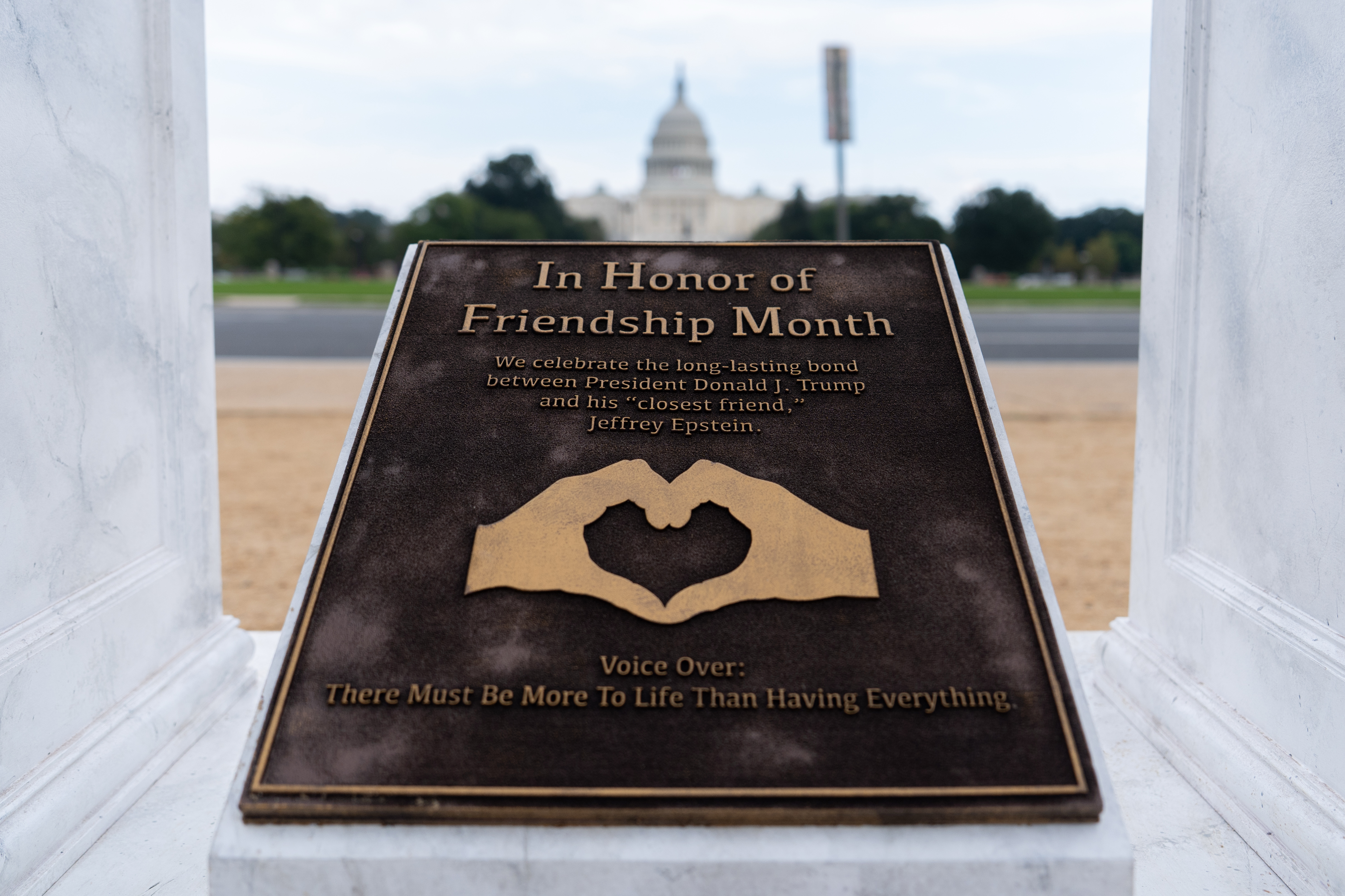 A work of protest art representing President Donald Trump and Jeffrey Epstein is seen on the National Mall near the Capitol, Tuesday, Sept. 23, 2025, in Washington. 