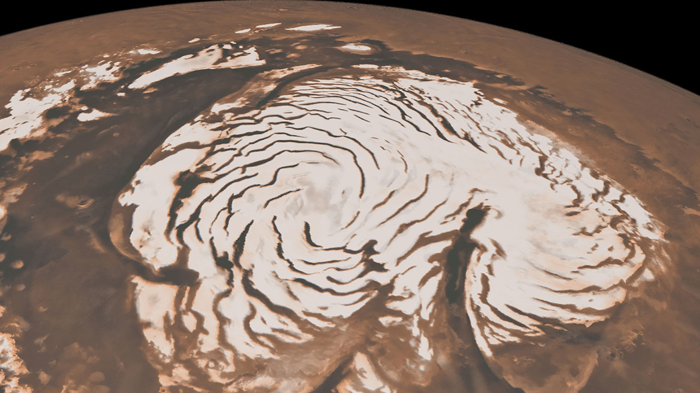 This image, combining data from two instruments aboard NASA's Mars Global Surveyor, depicts an orbital view of the north polar region of Mars.