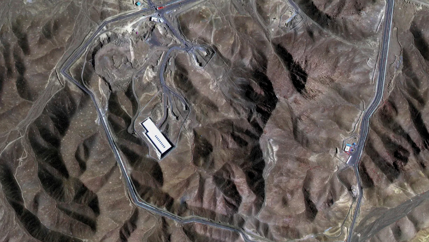 This satellite image provided by Maxar Technologies shows the Fordow enrichment facility in Iran before the US strikes.
