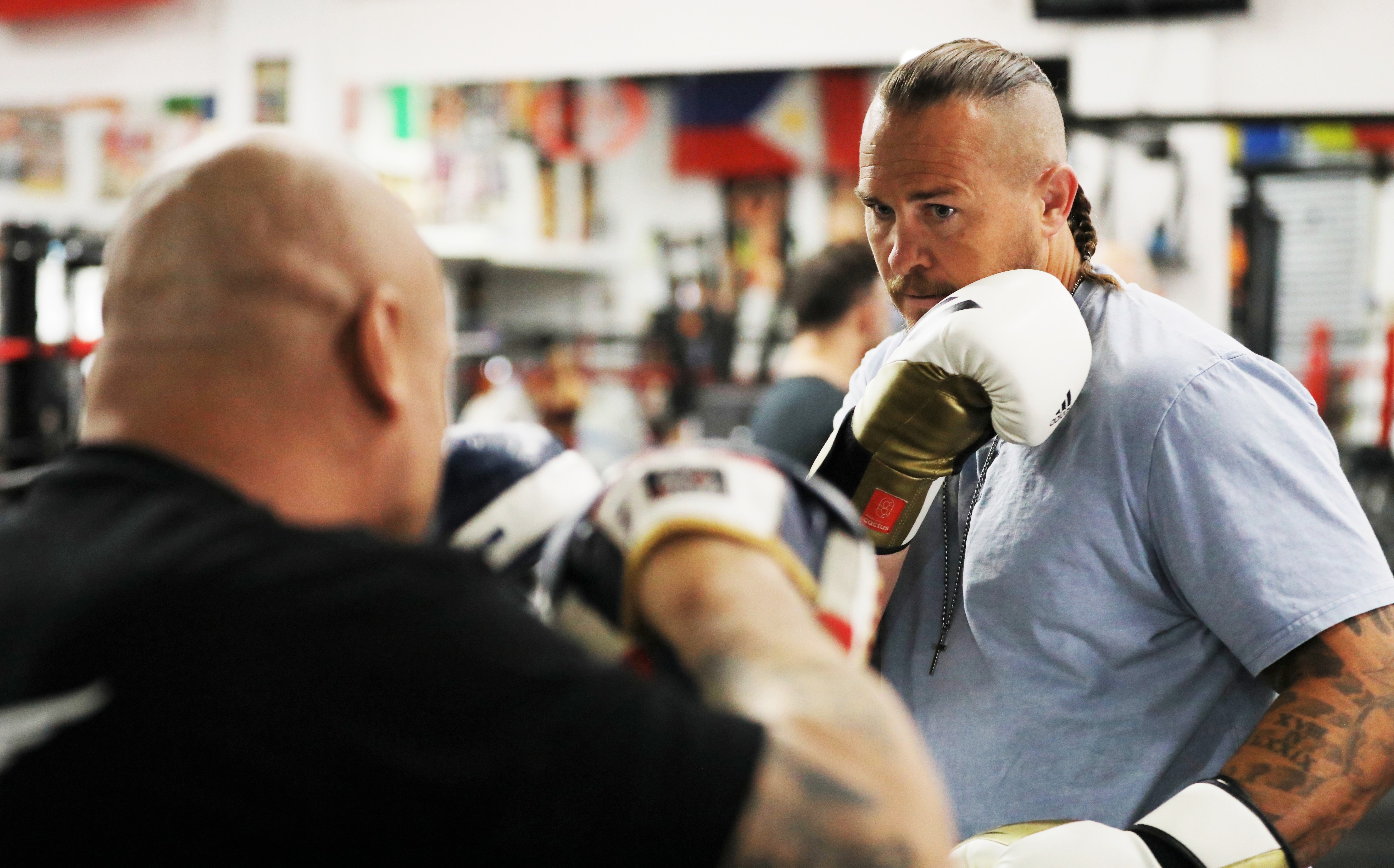 Matt Cooper dons the gloves for a sparring session at the Bondi Boxing Club.