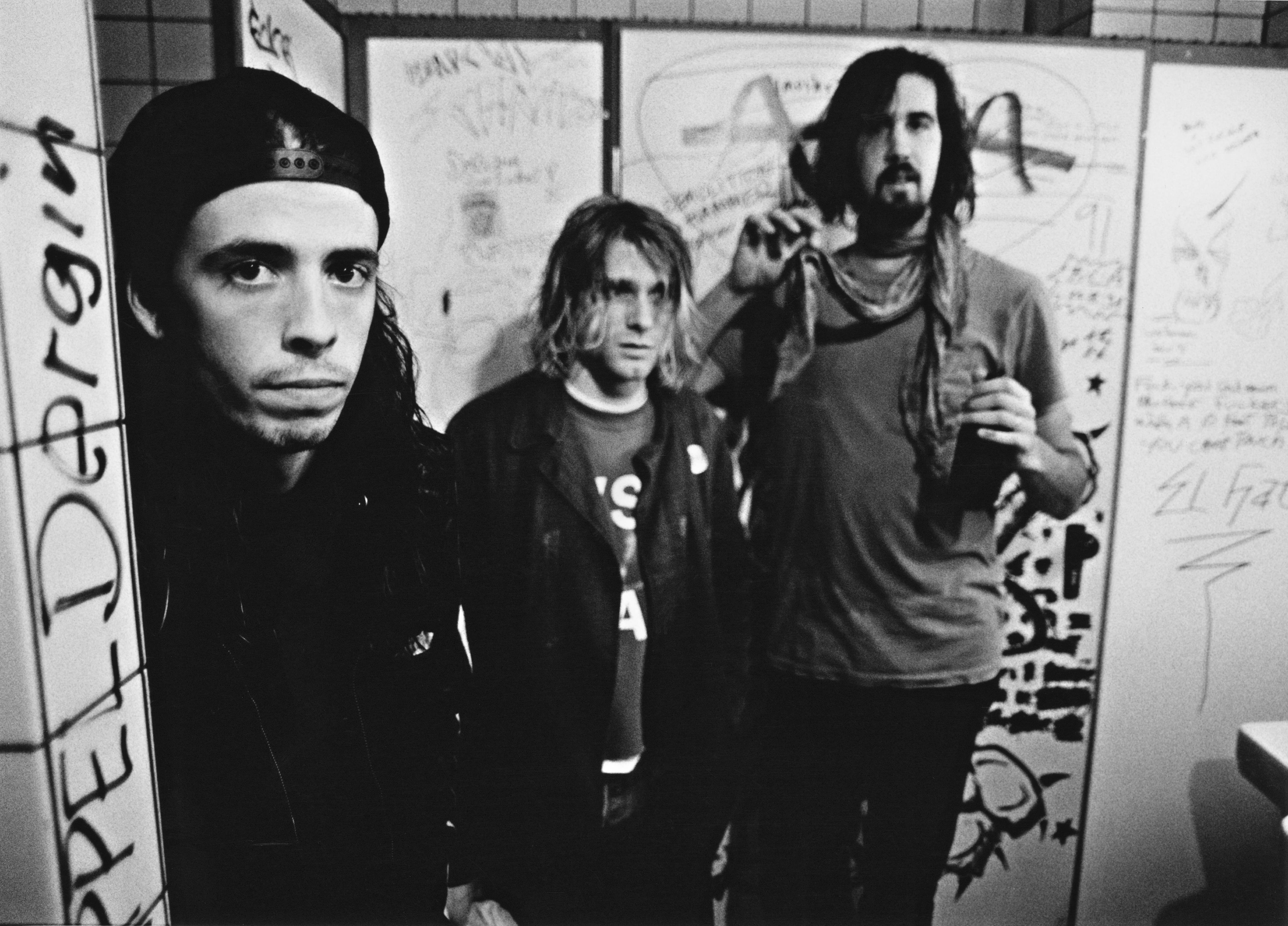 American rock group Nirvana, backstage in Frankfurt, Germany, 12th November 1991. Left to right: drummer Dave Grohl, singer and guitarist Kurt Cobain (1967 - 1994) and bassist Krist Novoselic. 