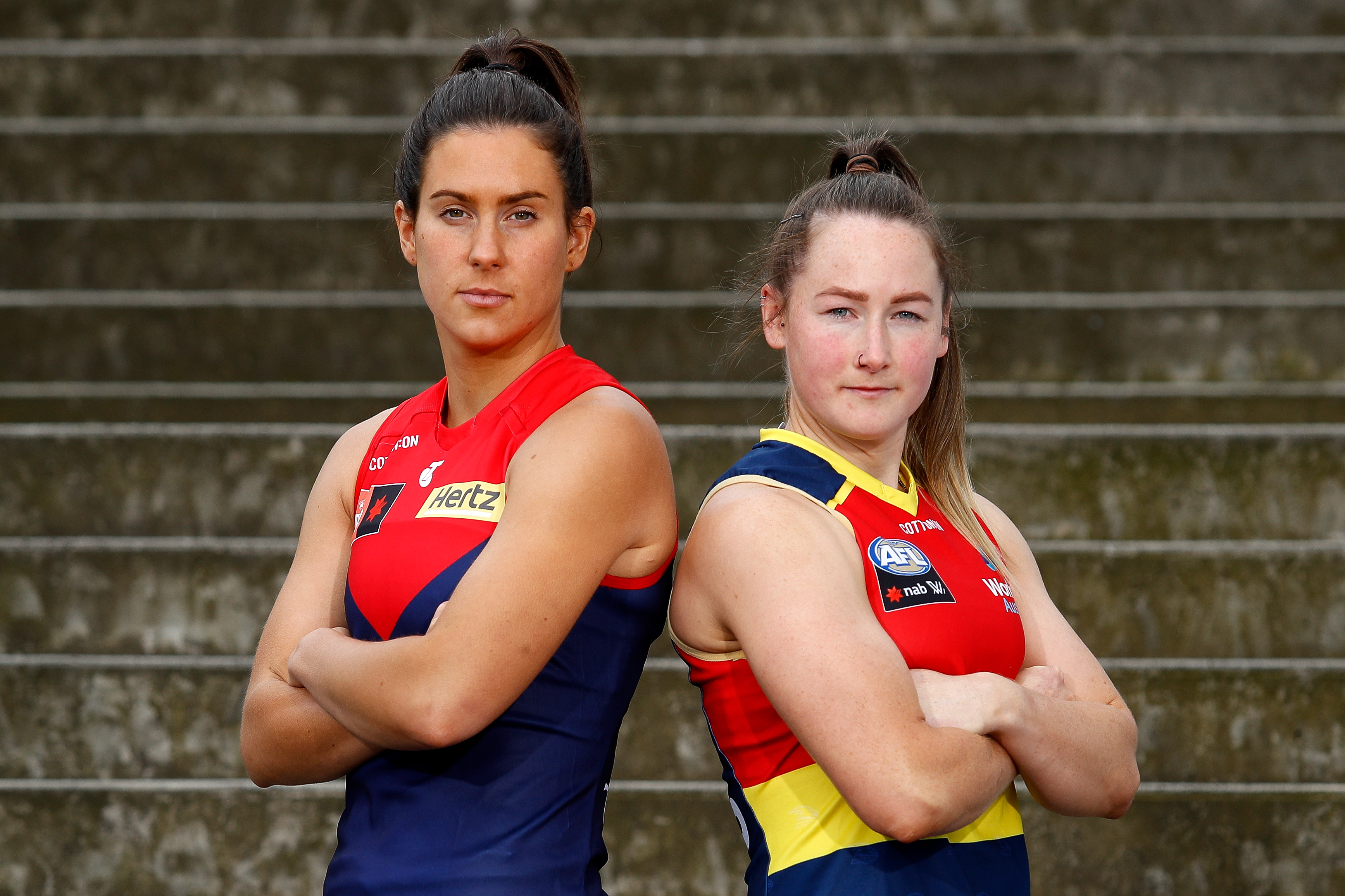 Melbourne's Libby Birch and Adelaide's Ailish Considine prepare to kick off the 2022 AFLW finals series.