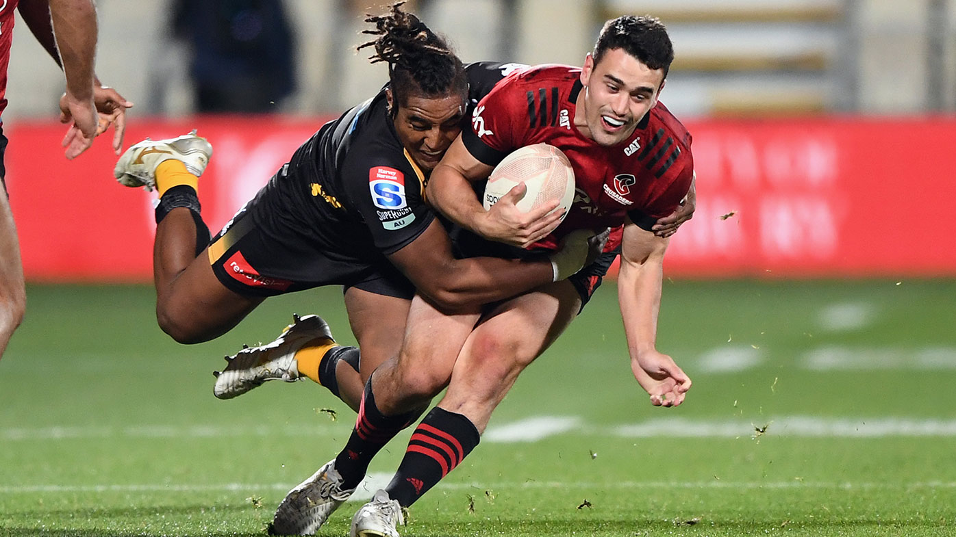 Will Jordan of the Crusaders is tackled by Feleti Kaitu'u of the Force during the round four Super Rugby Trans-Tasman match between the Crusaders and the Western Force at Orangetheory Stadium on June 04, 2021 in Christchurch, New Zealand. (Photo by Kai Schwoerer/Getty Images)