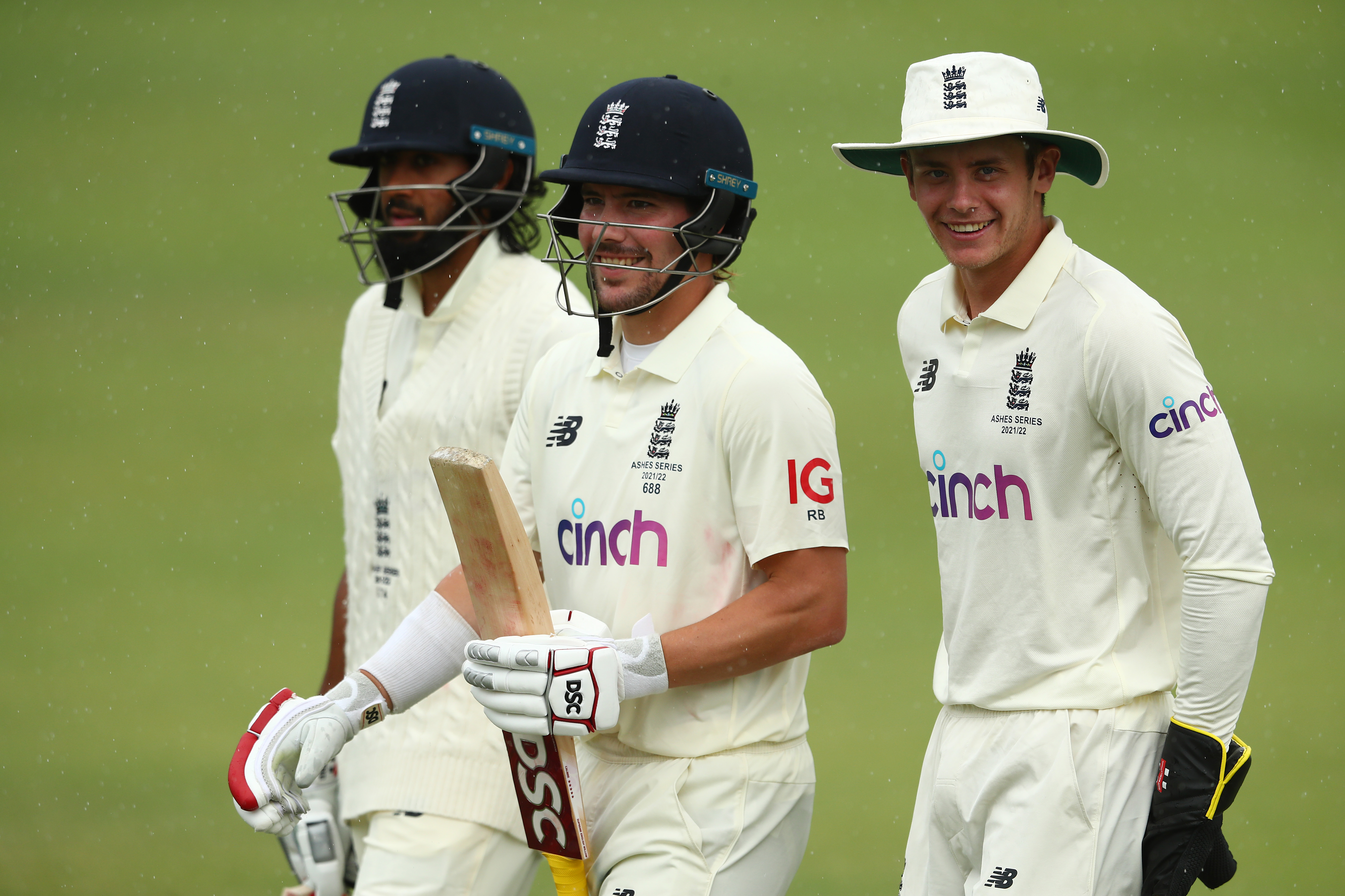 Rory Burns of England leaves the field as rain delays play during day one of the tour match between England and the England Lions.
