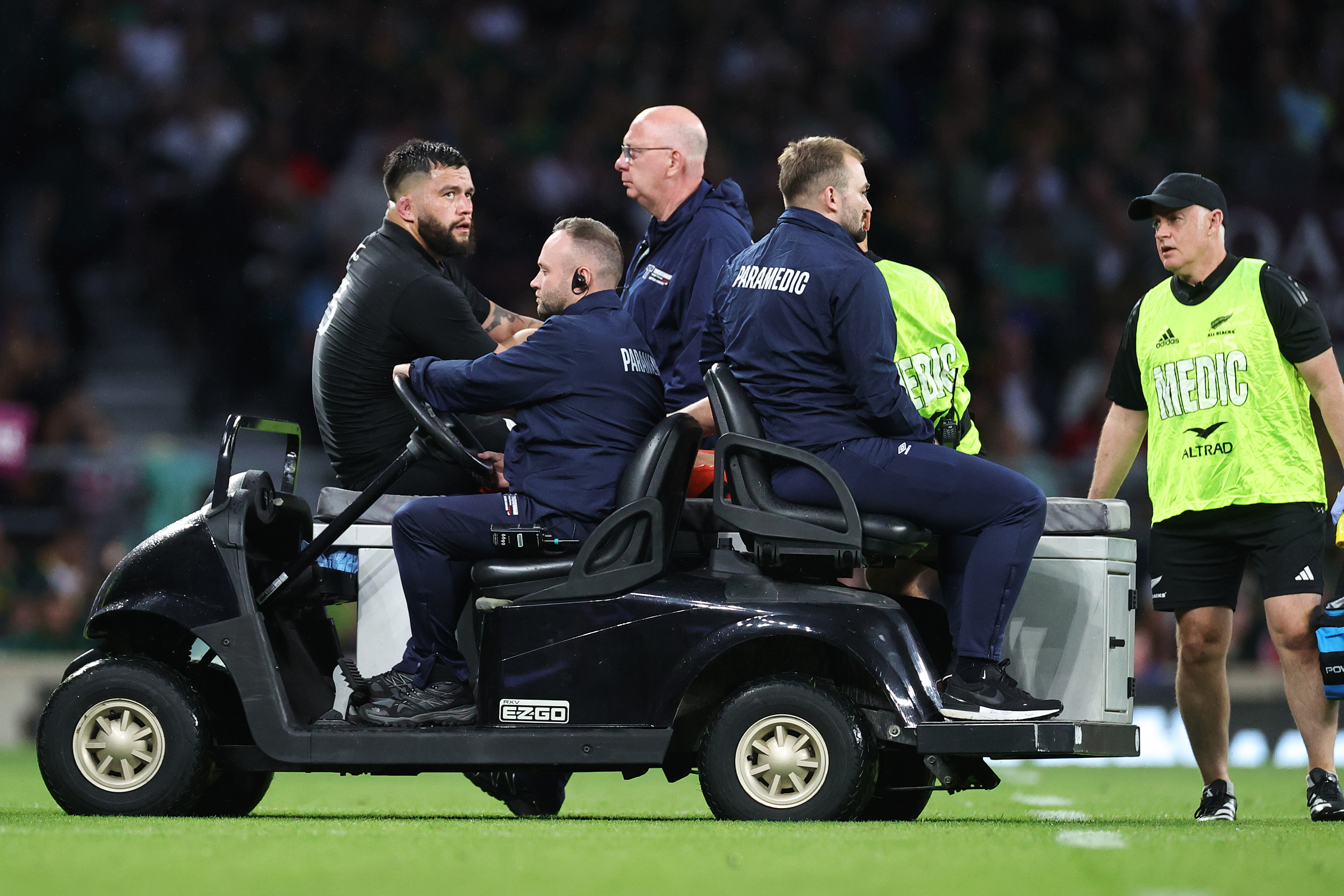 Tyrel Lomax of New Zealand is taken from the field by paramedics.