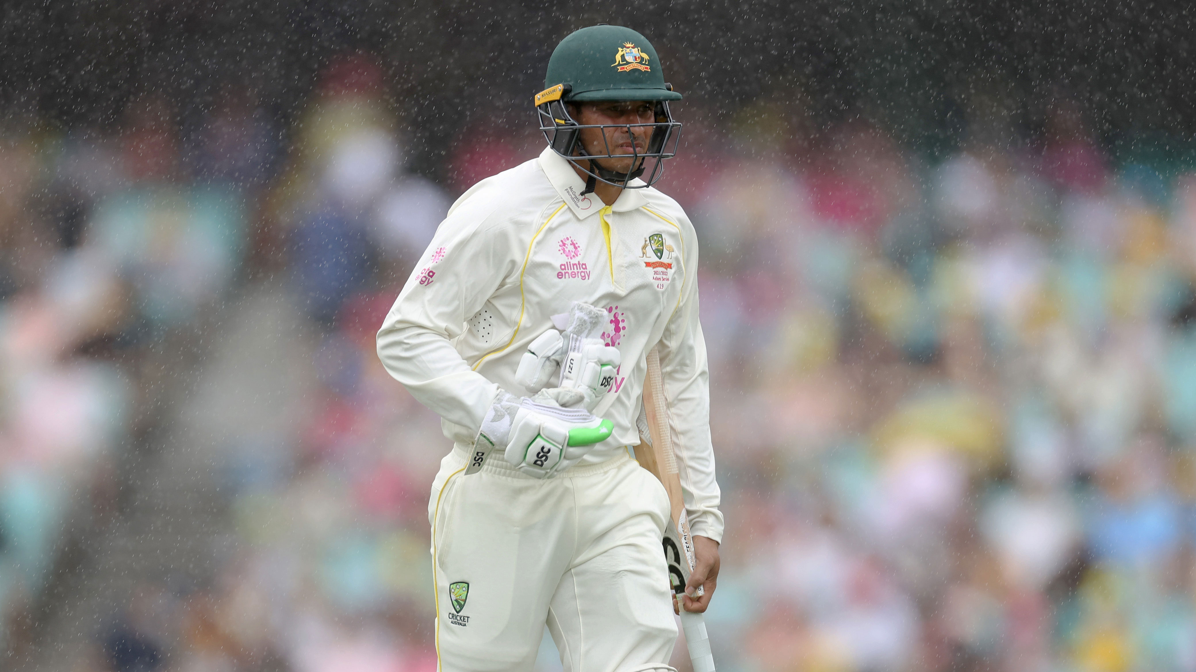 Usman Khawaja of Australia leaves the ground due to a rain delay during day two of the fourth Test in the Ashes.