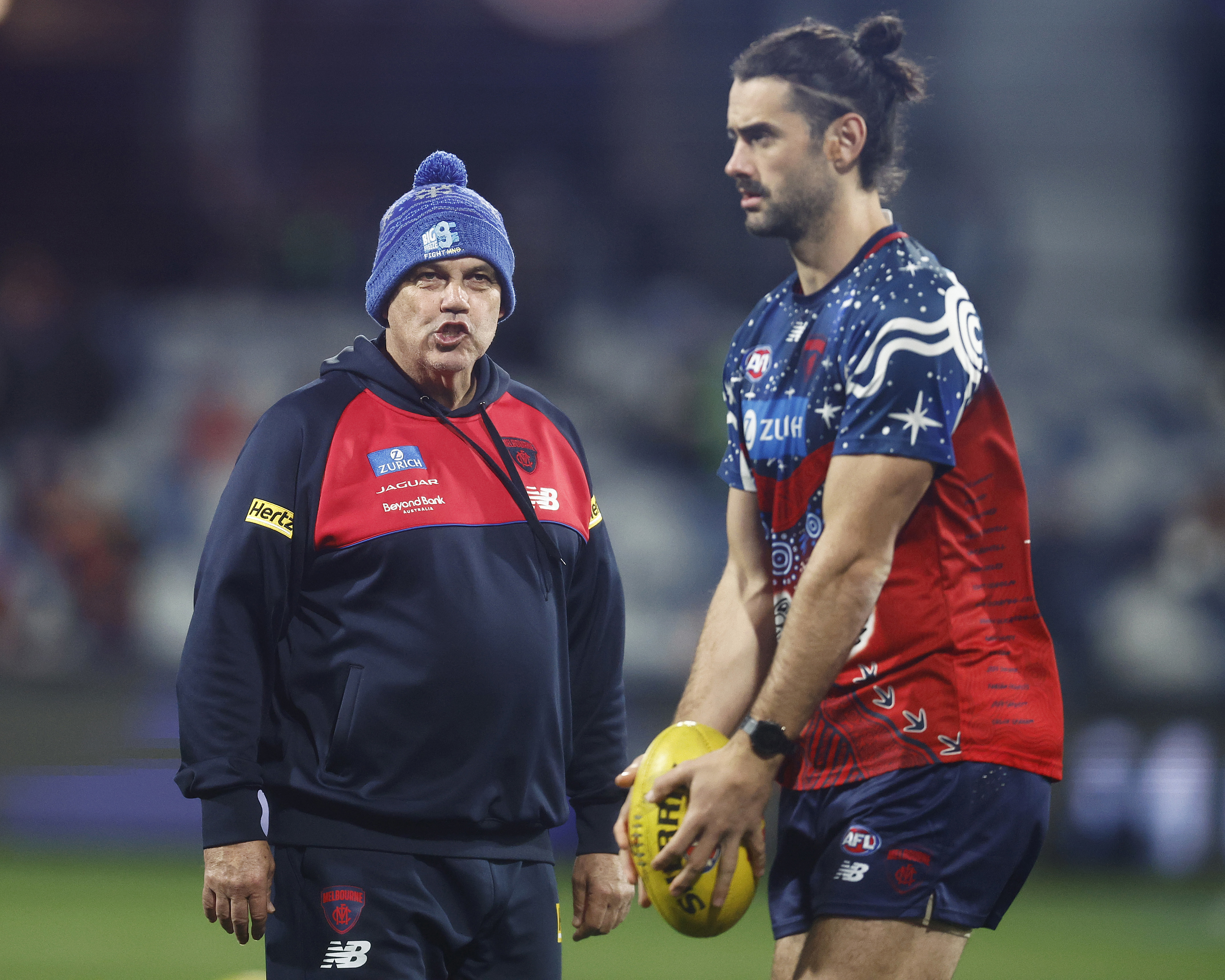 GEELONG, AUSTRALIA - JUNE 22: Demons assistant coach Mark Williams speaks with Brodie Grundy of the Demons before the round 15 AFL match between Geelong Cats and Melbourne Demons at GMHBA Stadium, on June 22, 2023, in Geelong, Australia. (Photo by Daniel Pockett/Getty Images)