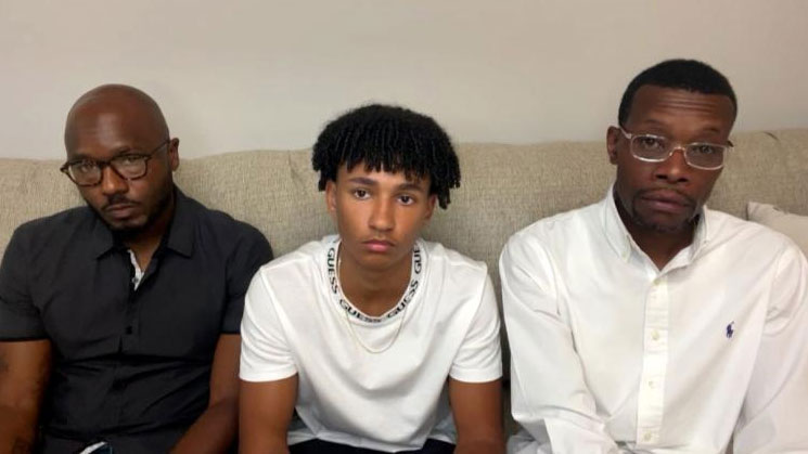 Roy Thorne, left, is seen with his 15-year-old son Samuel, middle, and real estate agent Eric Brown. All three were handcuffed by Wyoming, Michigan, police officers while touring a home.