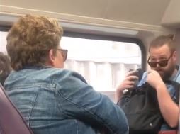 Woman coughs on commuter sparking bitter argument amid coronavirus fears.